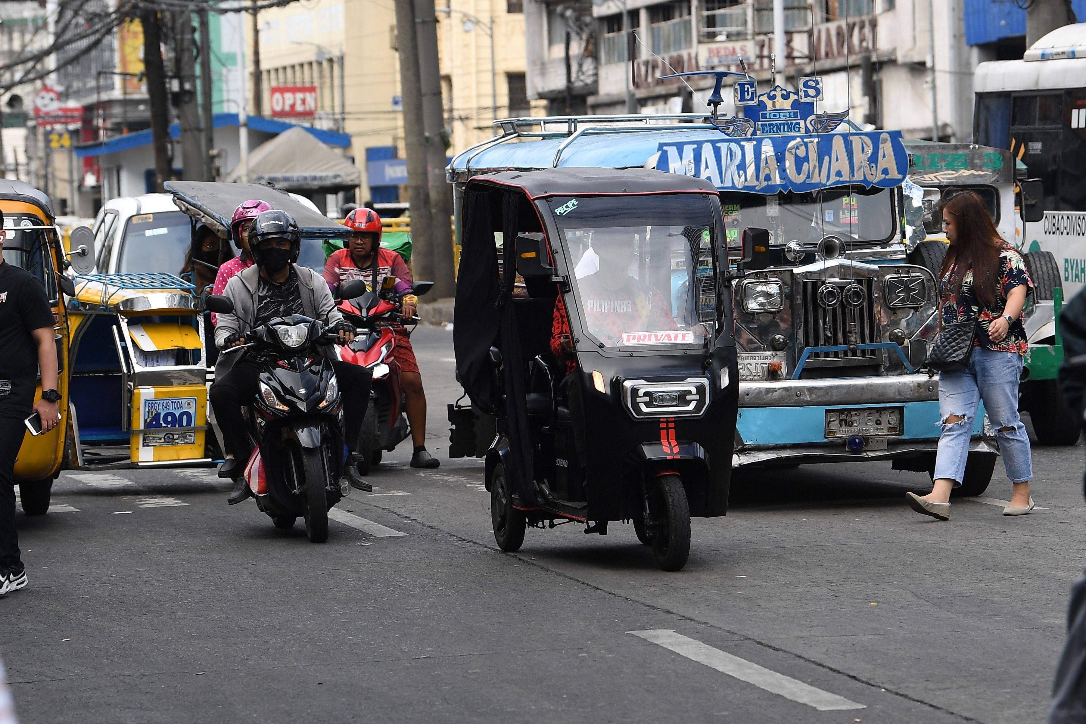 An electric tricycle traverses a street in Manila. There were 44,493 vehicular accidents in Metro Manila from January to July last year, 44,000 of which involved four-wheel vehicles. Photo: AFP