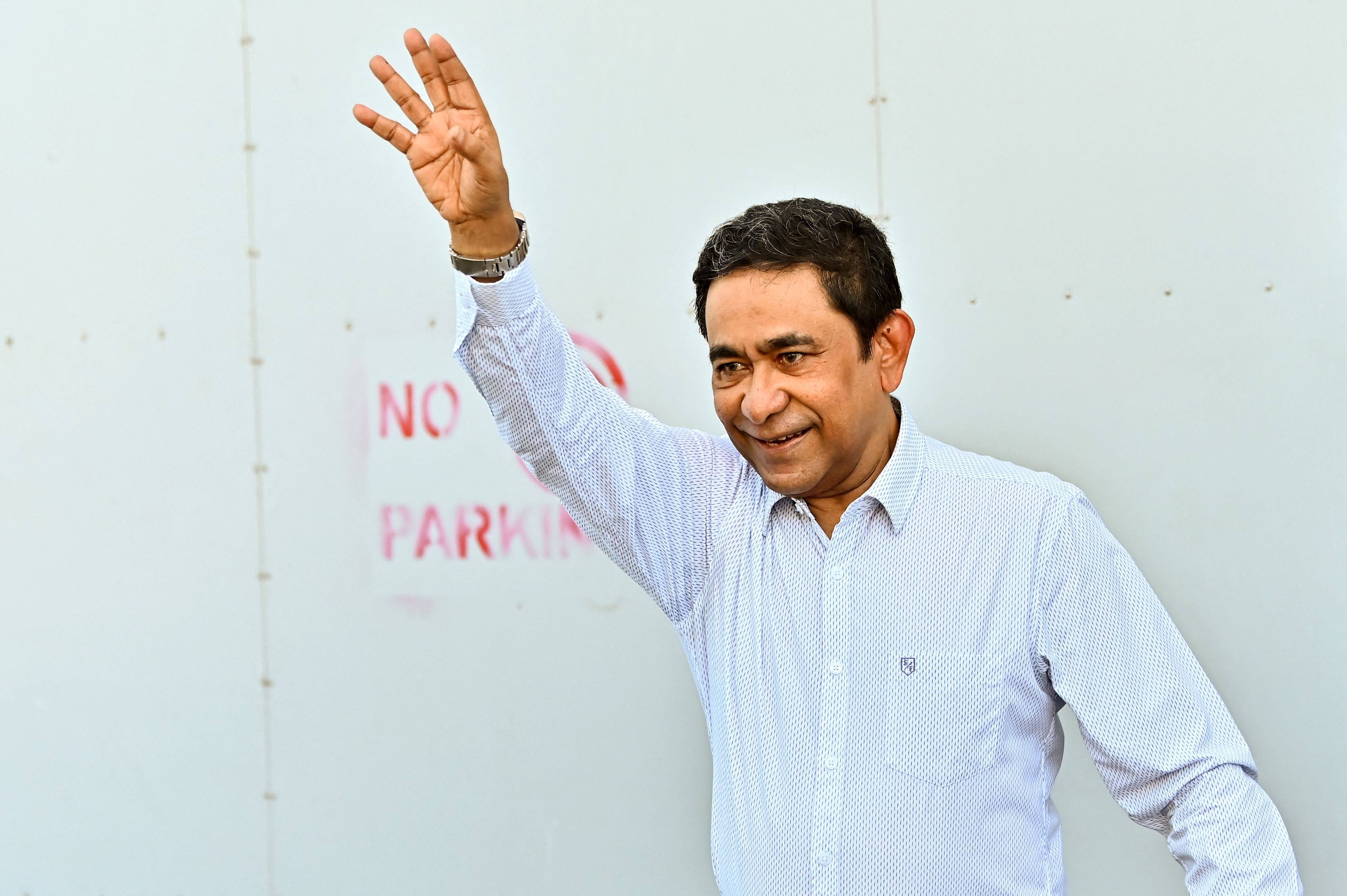 Former Maldives president Abdulla Yameen waves to supporters outside his home in Male on Thursday. Photo: AFP