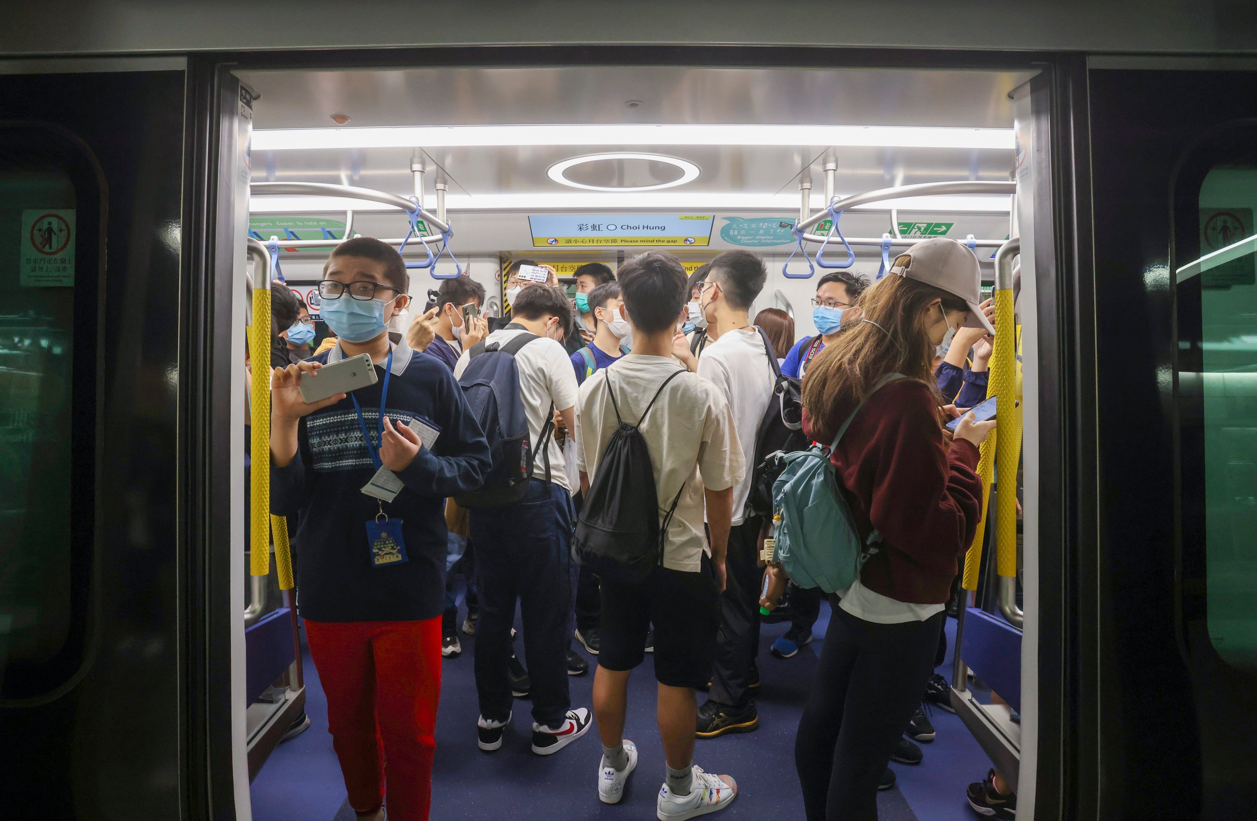 Rail fans take a new Q-train from Choi Hung MTR station on November 27, 2022. The Q-trains being rolled out on the Island and Tsuen Wan Lines were ordered nearly a decade prior. Photo: Jonathan Wong 