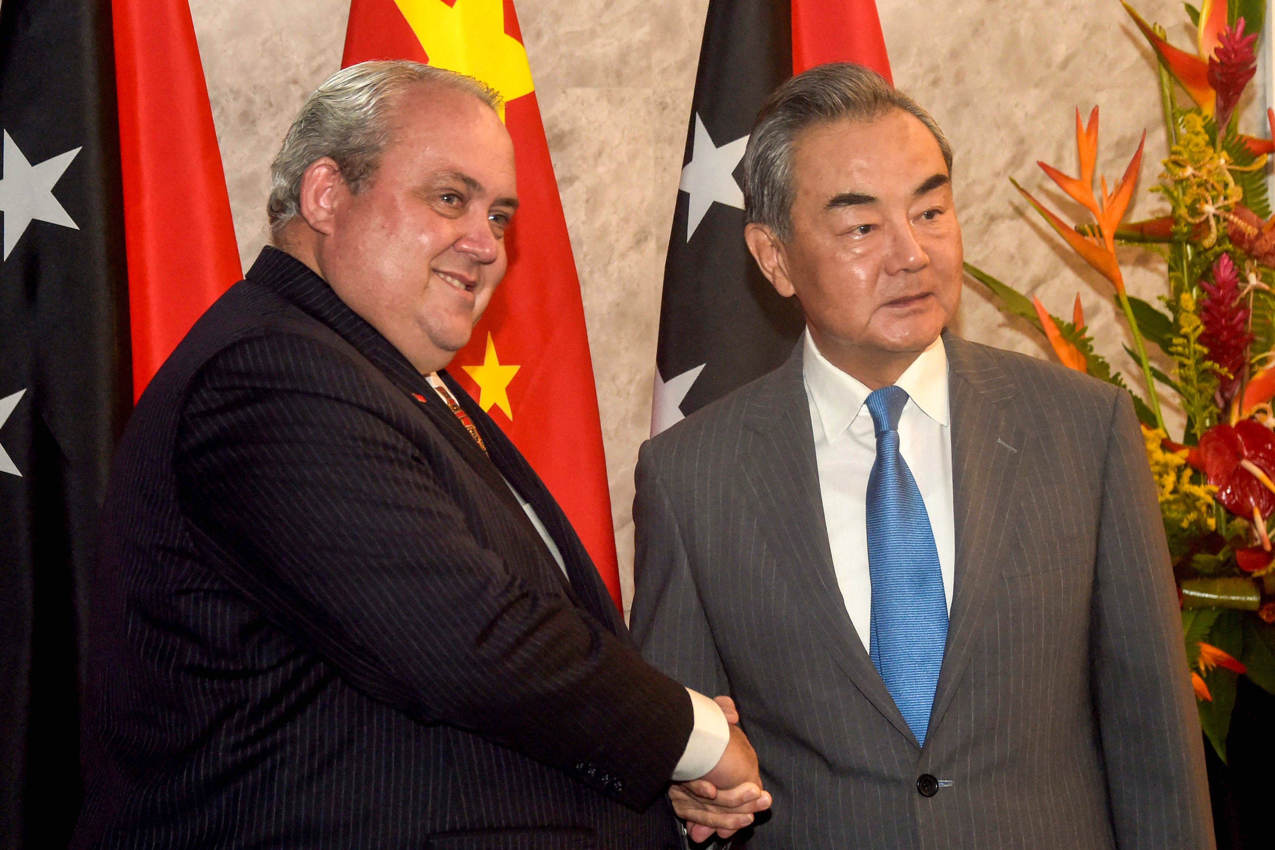 Chinese Foreign Minister Wang Yi with PNG counterpart Justin Tkatchenko ahead of talks in PNG capital Port Moresby on Saturday. Photo: AFP
