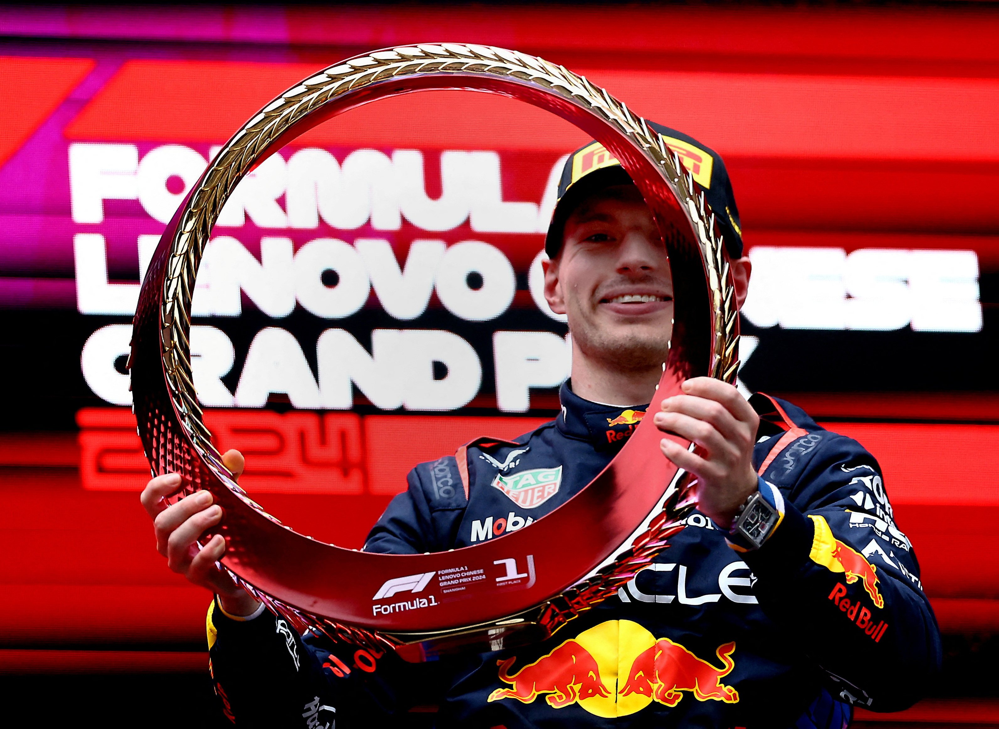Red Bull’s Max Verstappen celebrates on the podium after winning the Chinese Grand Prix. Photo: Reuters