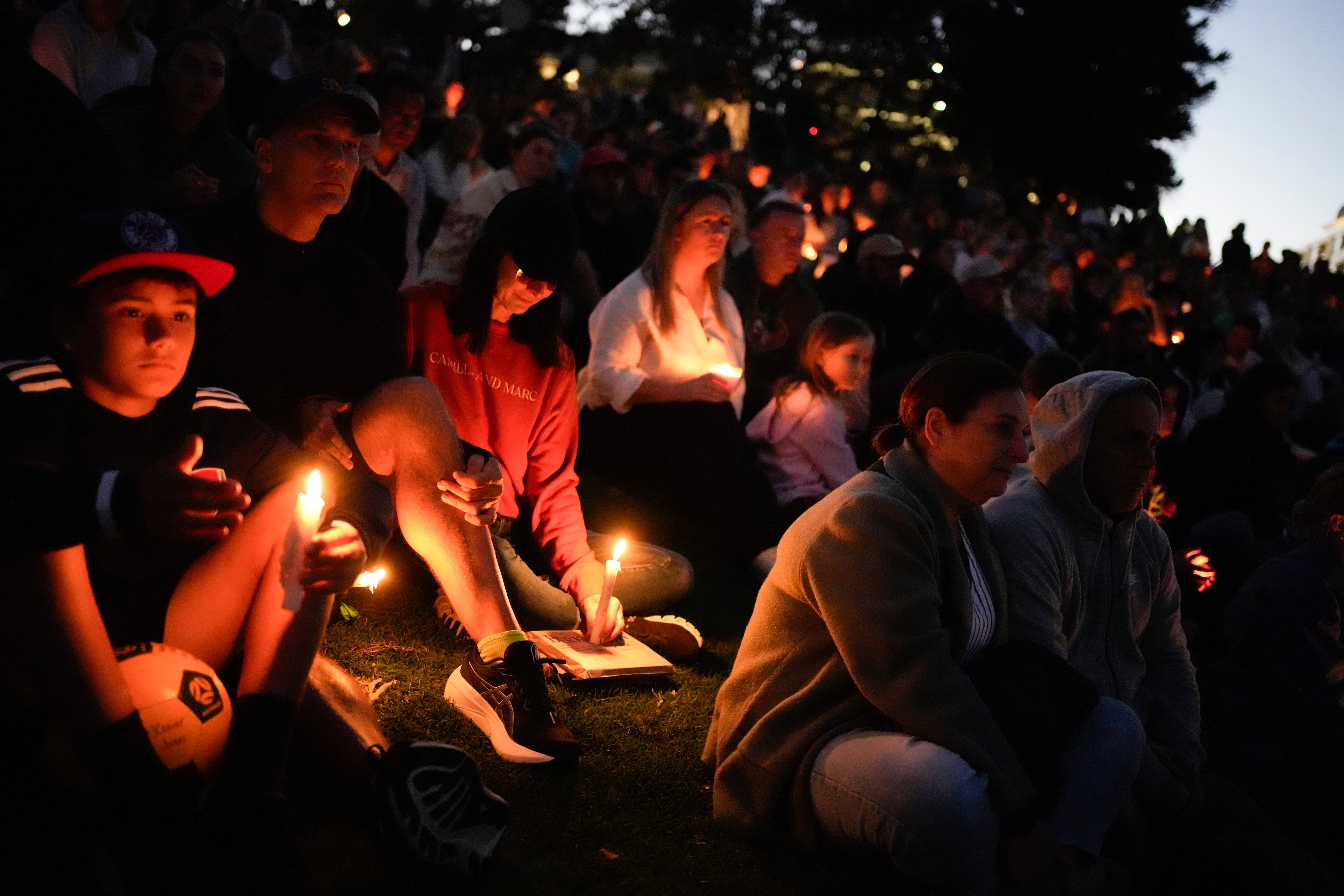 Mourners hold a candlelight vigil on Sunday at Sydney’s Bondi Beach to remember victims of a knife attack at a nearby shopping centre. Photo: AP