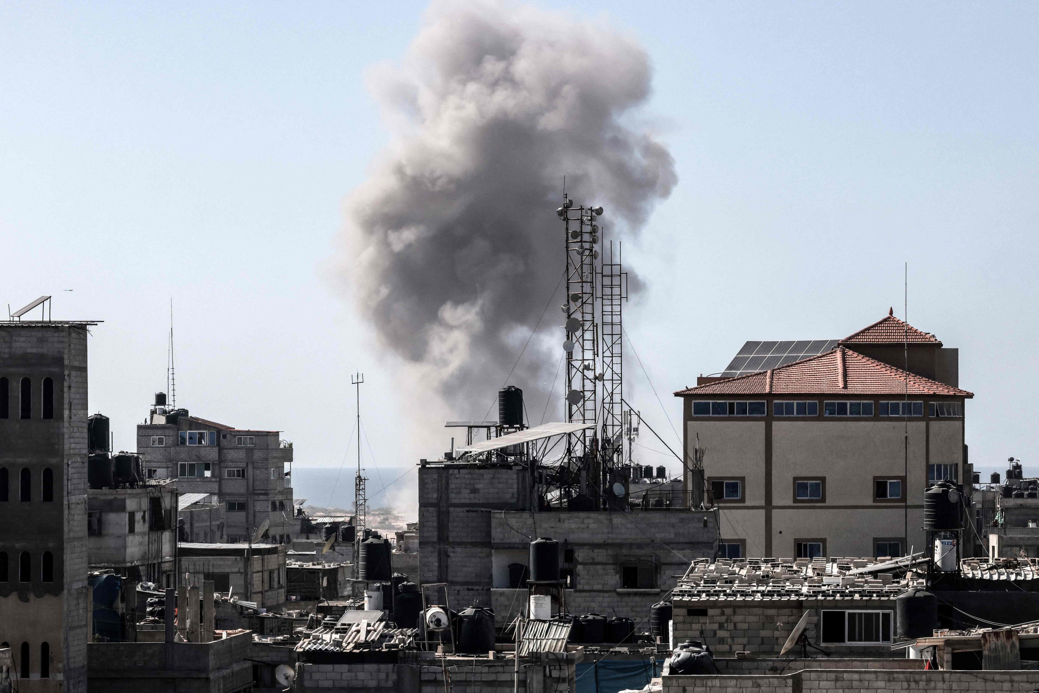 Smoke rises above buildings during Israeli bombardment in Rafah in the southern Gaza Strip on Sunday. Photo: AFP