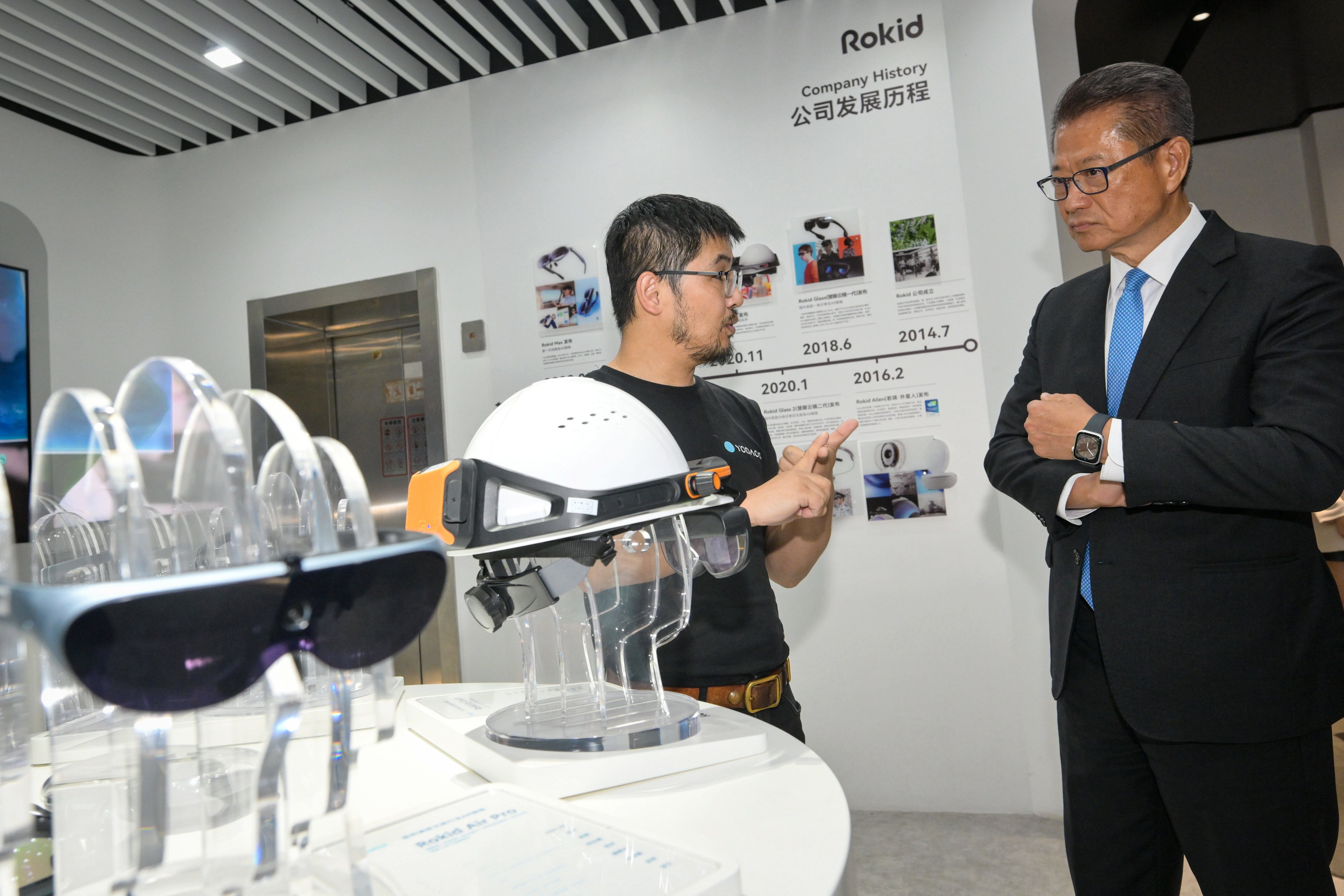 Paul Chan (right) visits an innovation and tech enterprise in Hangzhou while on a trip to the mainland last week. Photo: ISD
