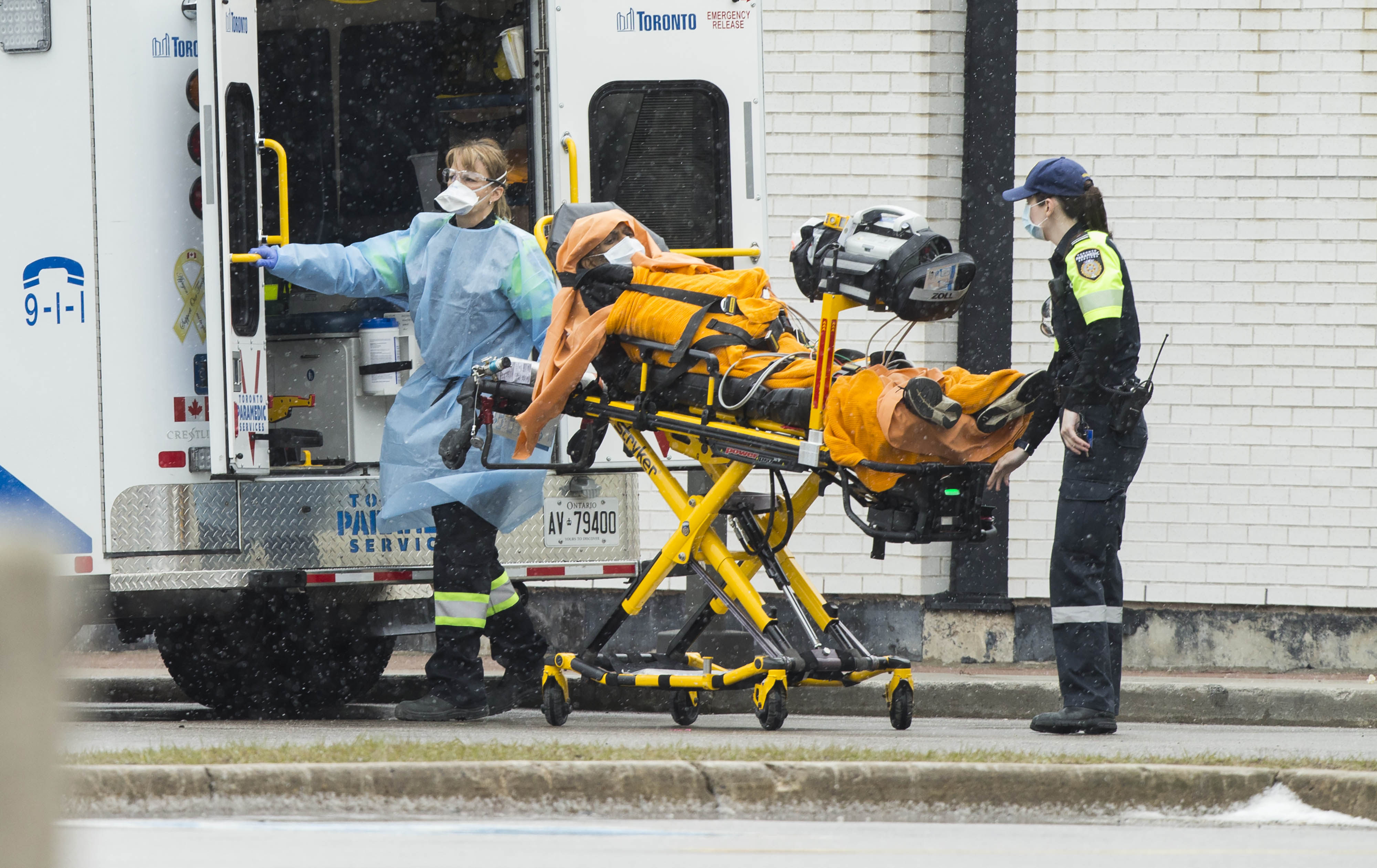 A patient is wheeled out from an ambulance to Scarborough Health Network Centenary Hospital in Toronto, Canada. Photo: Xinhua