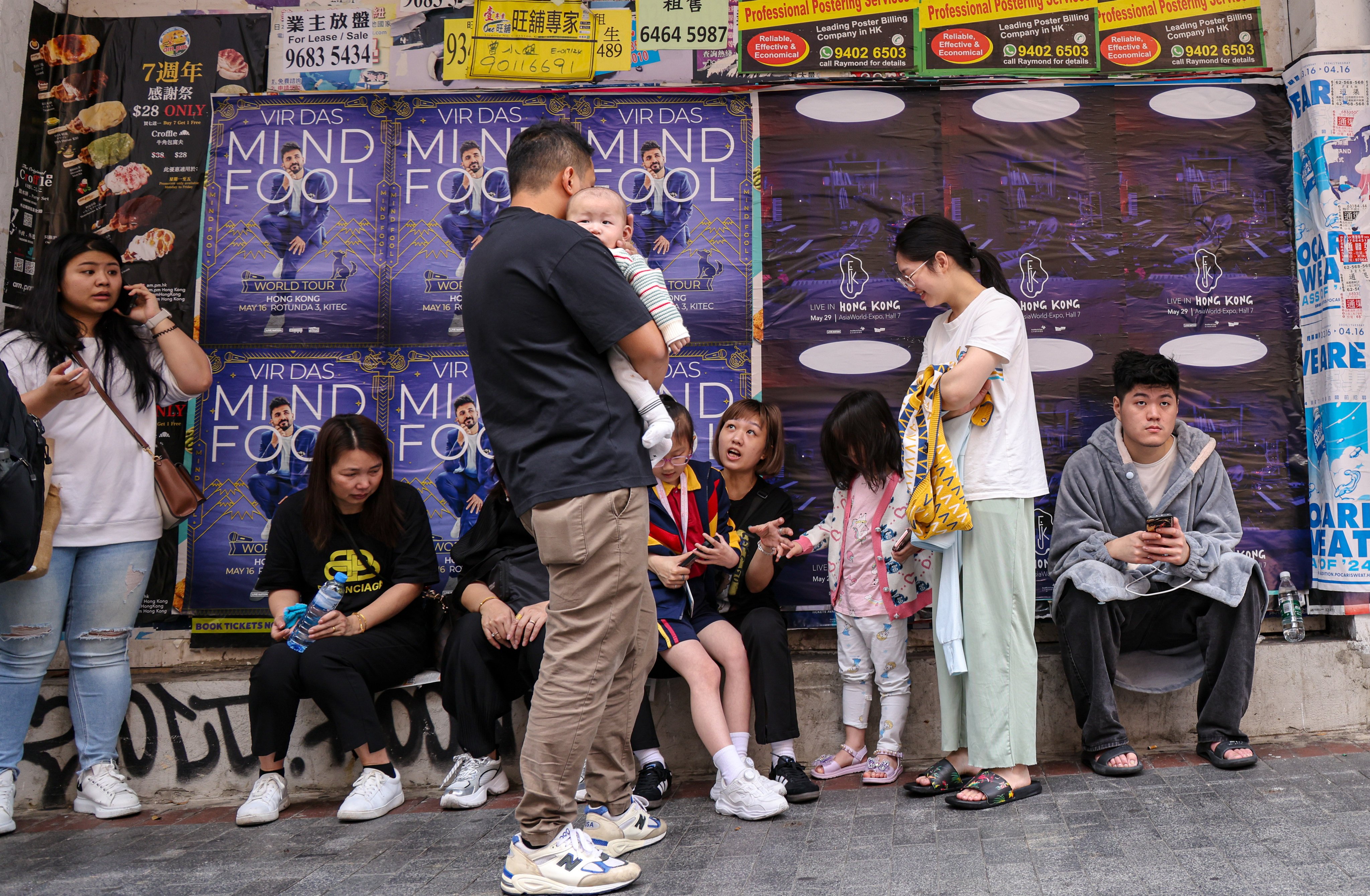 Residents congregate after a fire broke out at New Lucky House in Hong Kong’s Yau Ma Tei neighbourhood on April 10. Photo: Jelly Tse