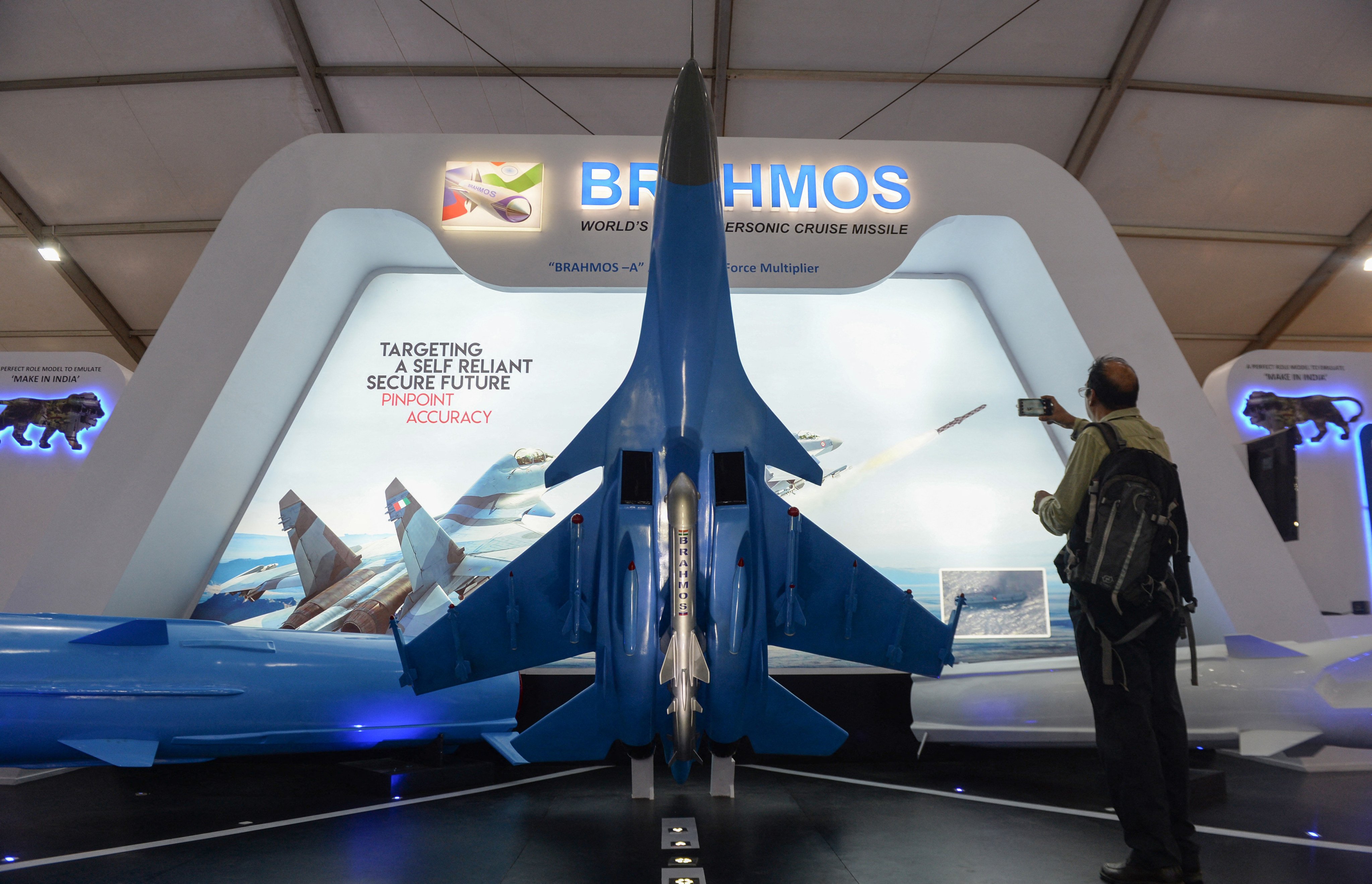 A visitor admires a BrahMos missile on display at the stall of India’s Defence Research and Development Organisation at a defence expo on the outskirts of Chennai in 2018. Photo: AFP