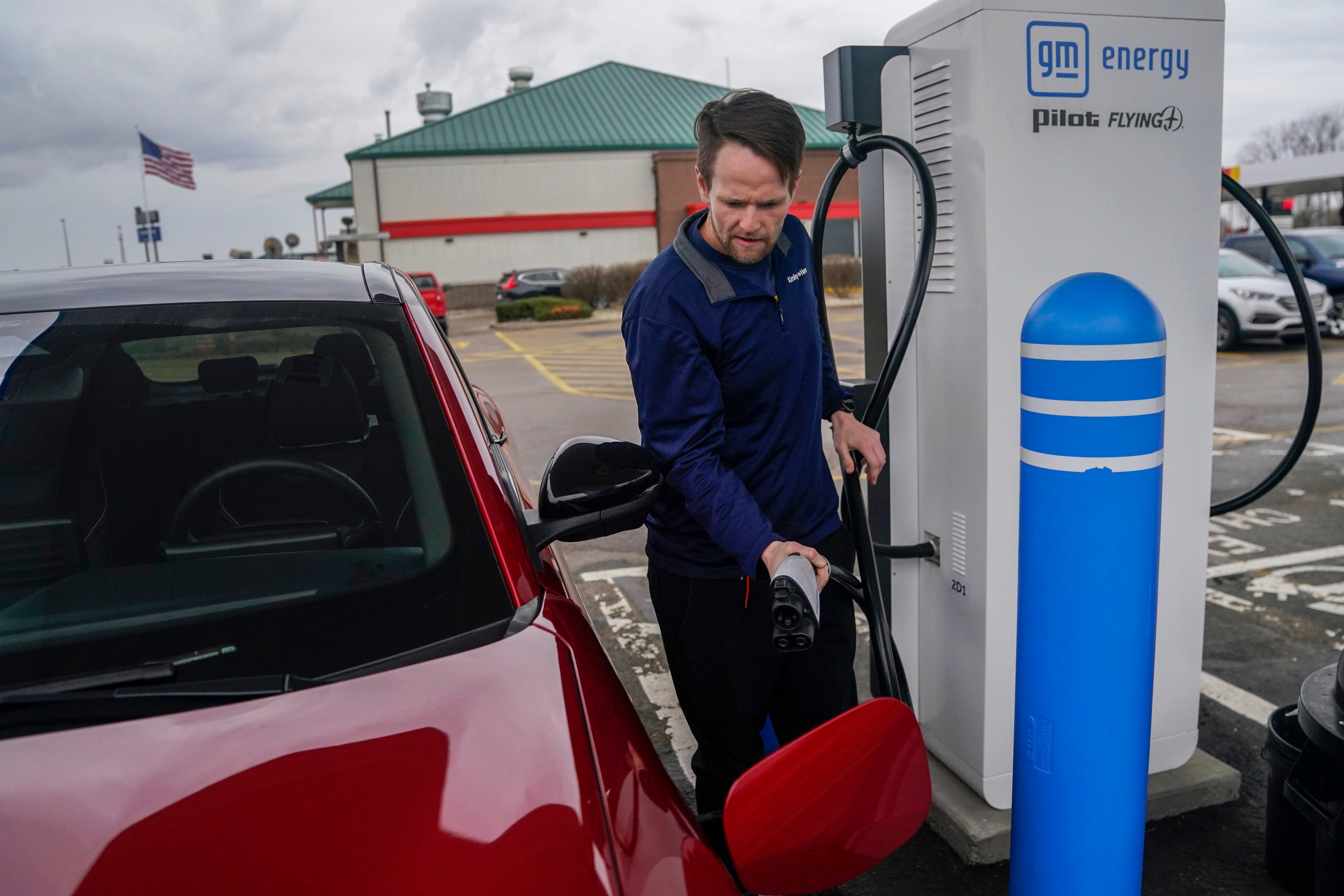 An electric car owner recharges his vehicle at a charging station in London, Ohio, the US on March 8. If EV pricing in the US can approach the level of China’s, demand will mushroom. Photo: AP