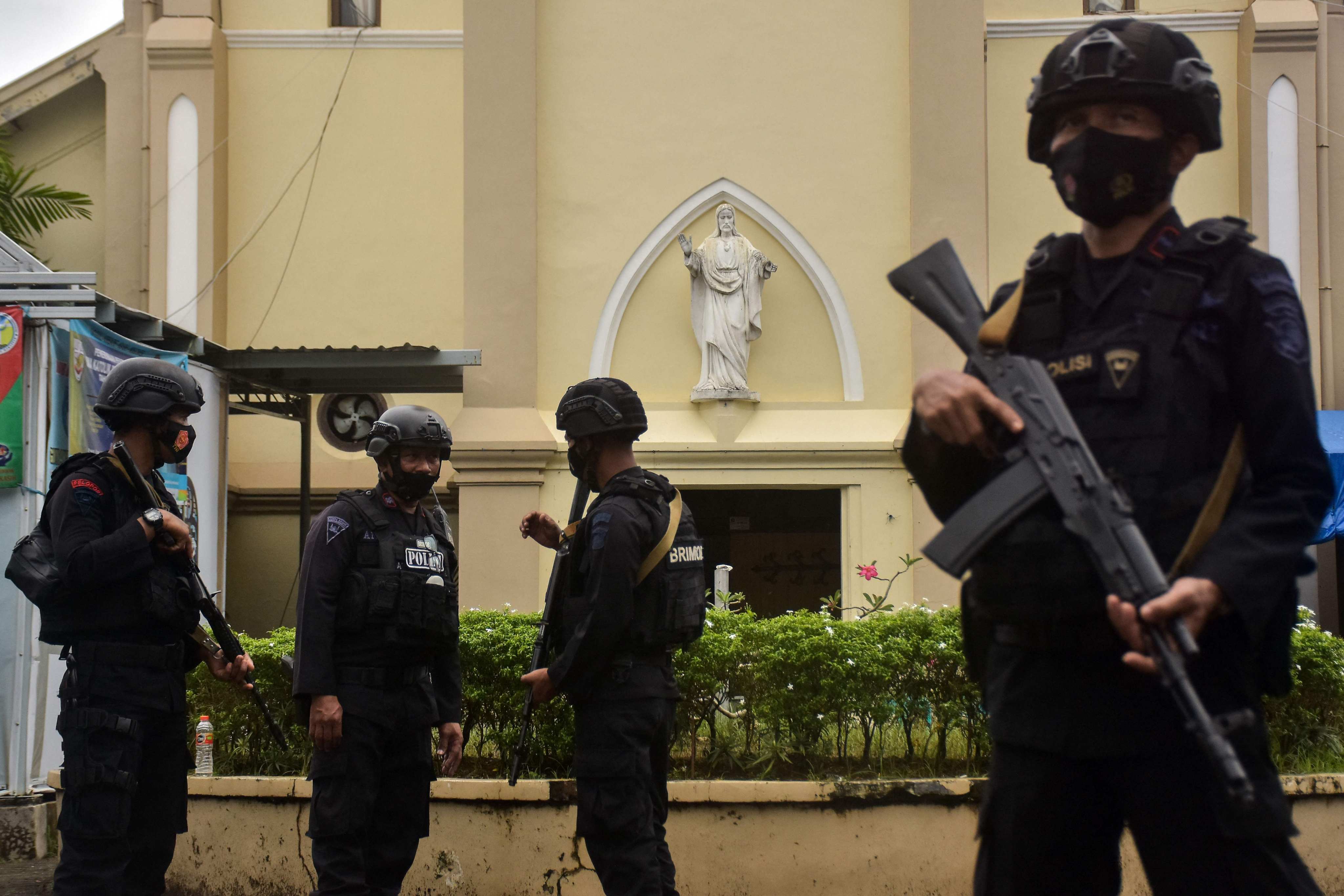 A special police team beefs up security at a cathedral in Makassar in March 2021, following an earlier suicide bombing. Photo: AFP