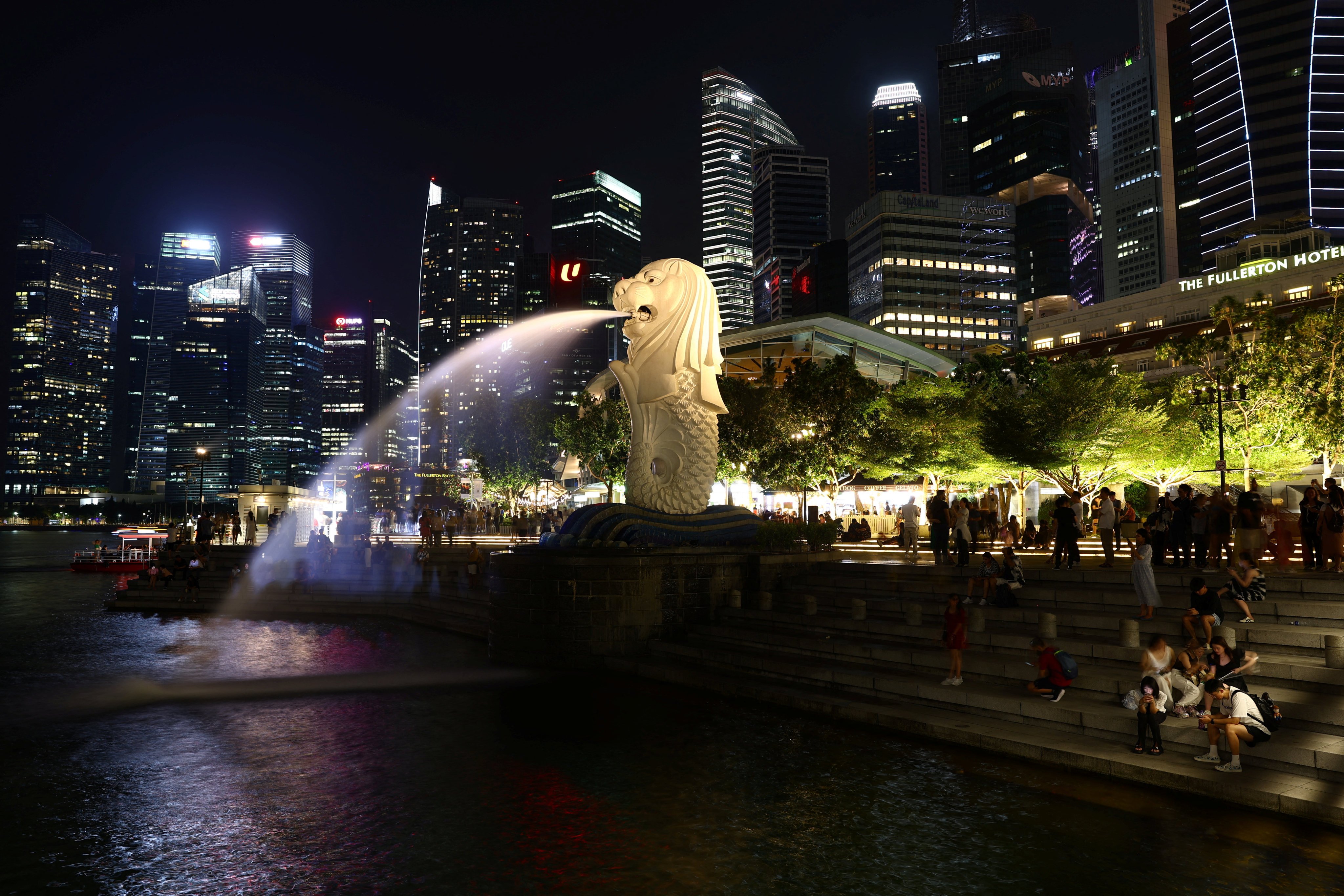 Singapore’s Merlion Park and central business district. The accused was upset about his girlfriend’s relationships with other men when he punched and kicked her, the court heard. Photo: Reuters