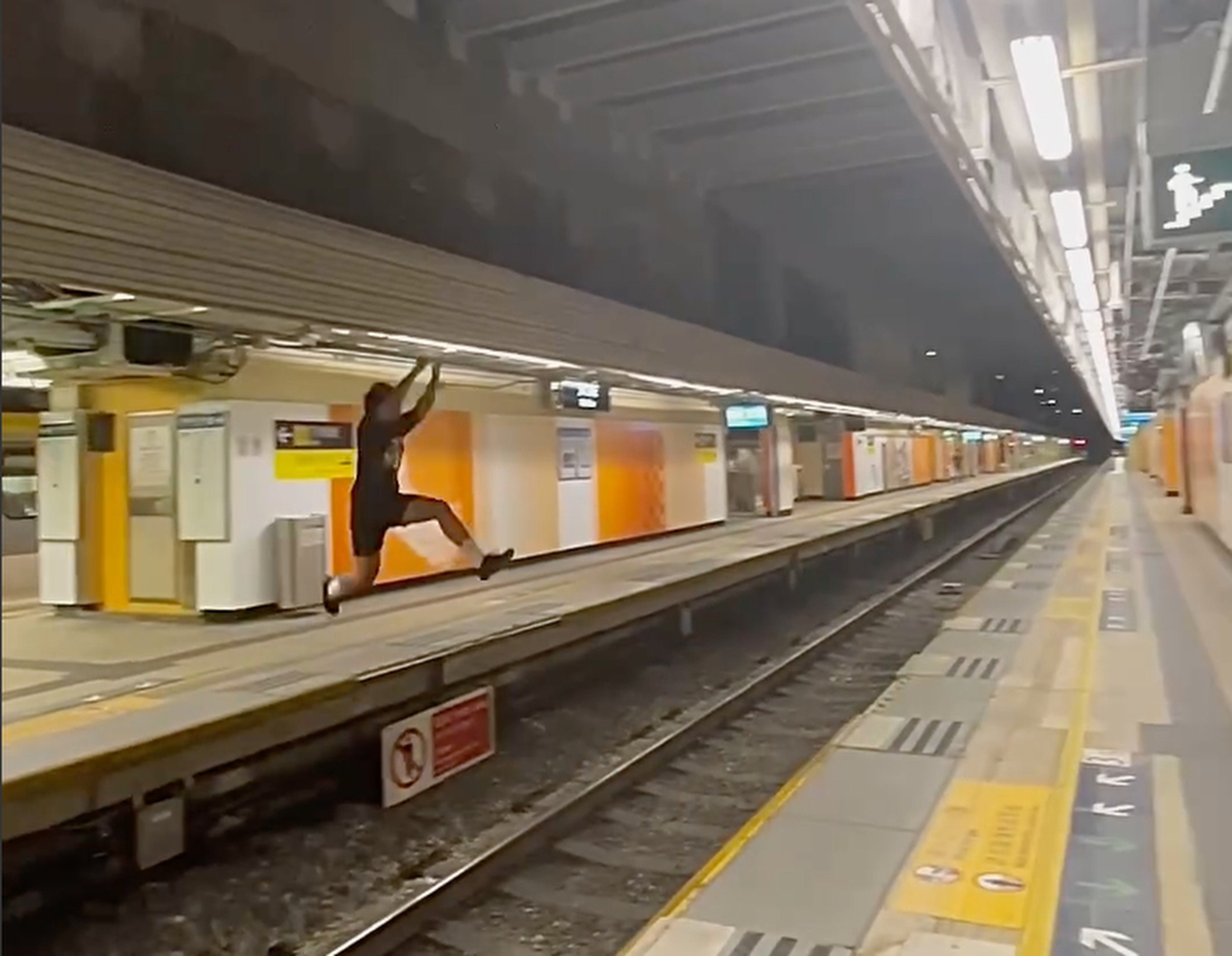 A screengrab shows a man jumping across platforms at Fo Tan station. Photo: Instagram