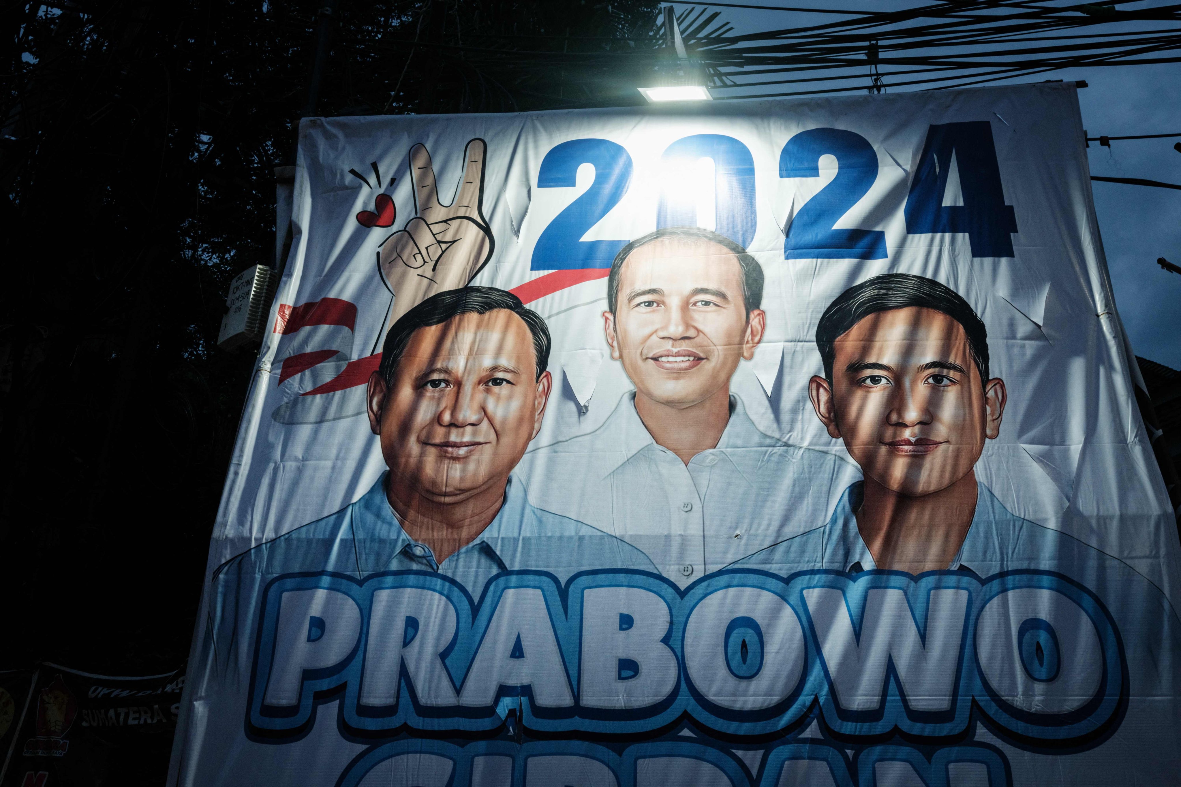Posters of presidential candidate Prabowo Subianto and VP candidate Gibran Rakabuming Raka, son of President Joko Widodo, at a street in Jakarta ahead of the country’s 2024 presidential election. Photo: AFP
