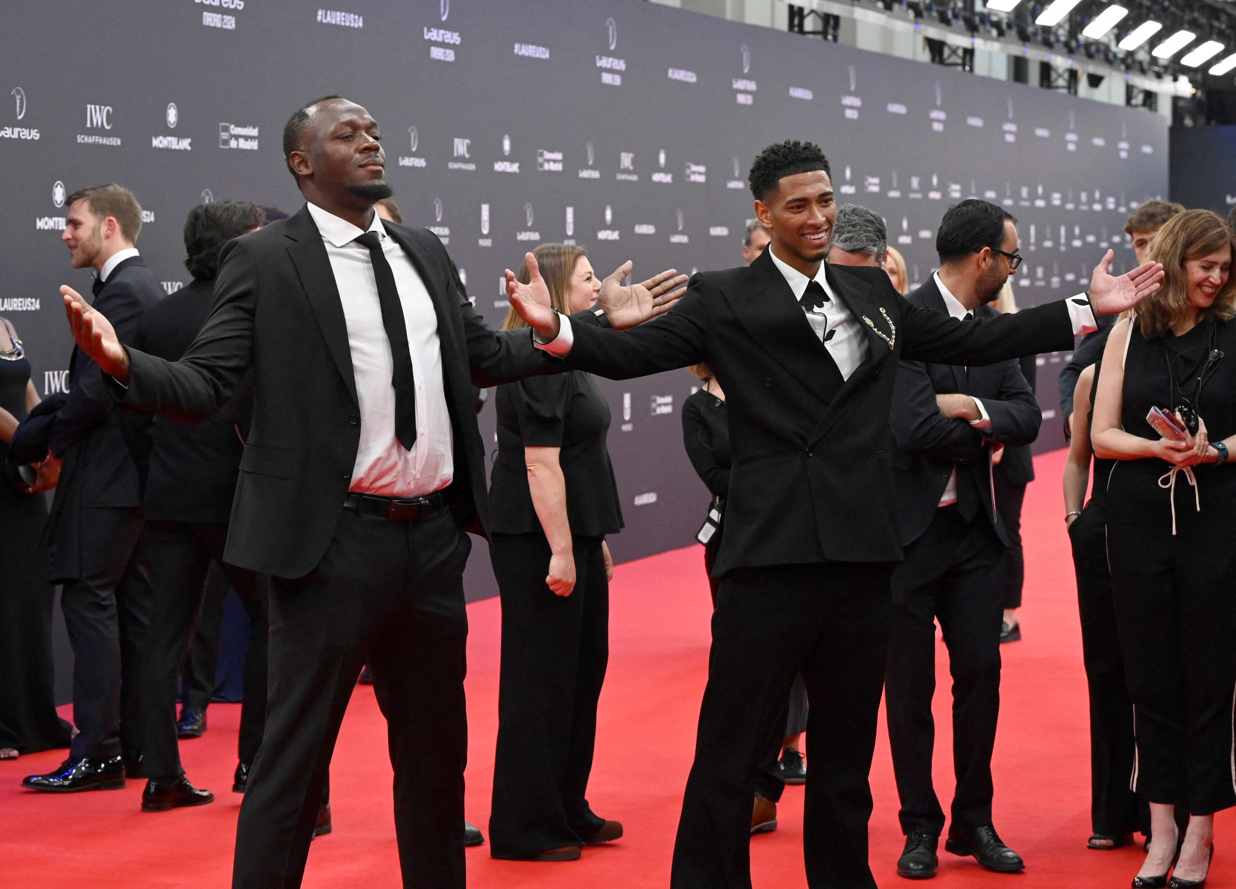 Jamaican sprint legend Usain Bolt (left) and Real Madrid’s Jude Bellingham recreate the latter’s open arms goal celebration at the Laureus World Sports Awards in Madrid on Monday. Photo: AFP