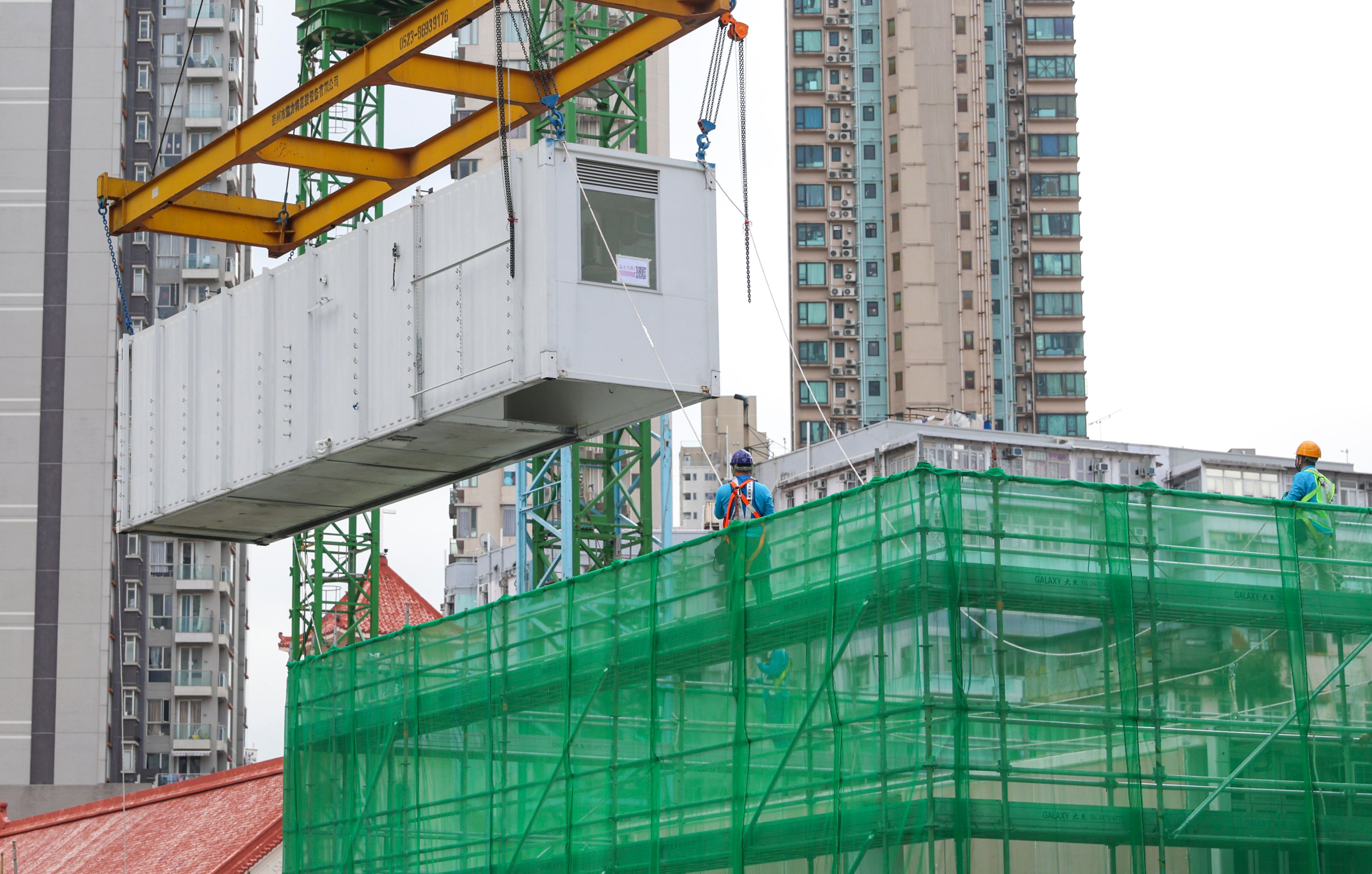 The “modular integrated construction” process employs free-standing, integrated modules from a mainland Chinese factory that undergo quality inspections before being installed at the project site. Photo: Yik Yeung-man