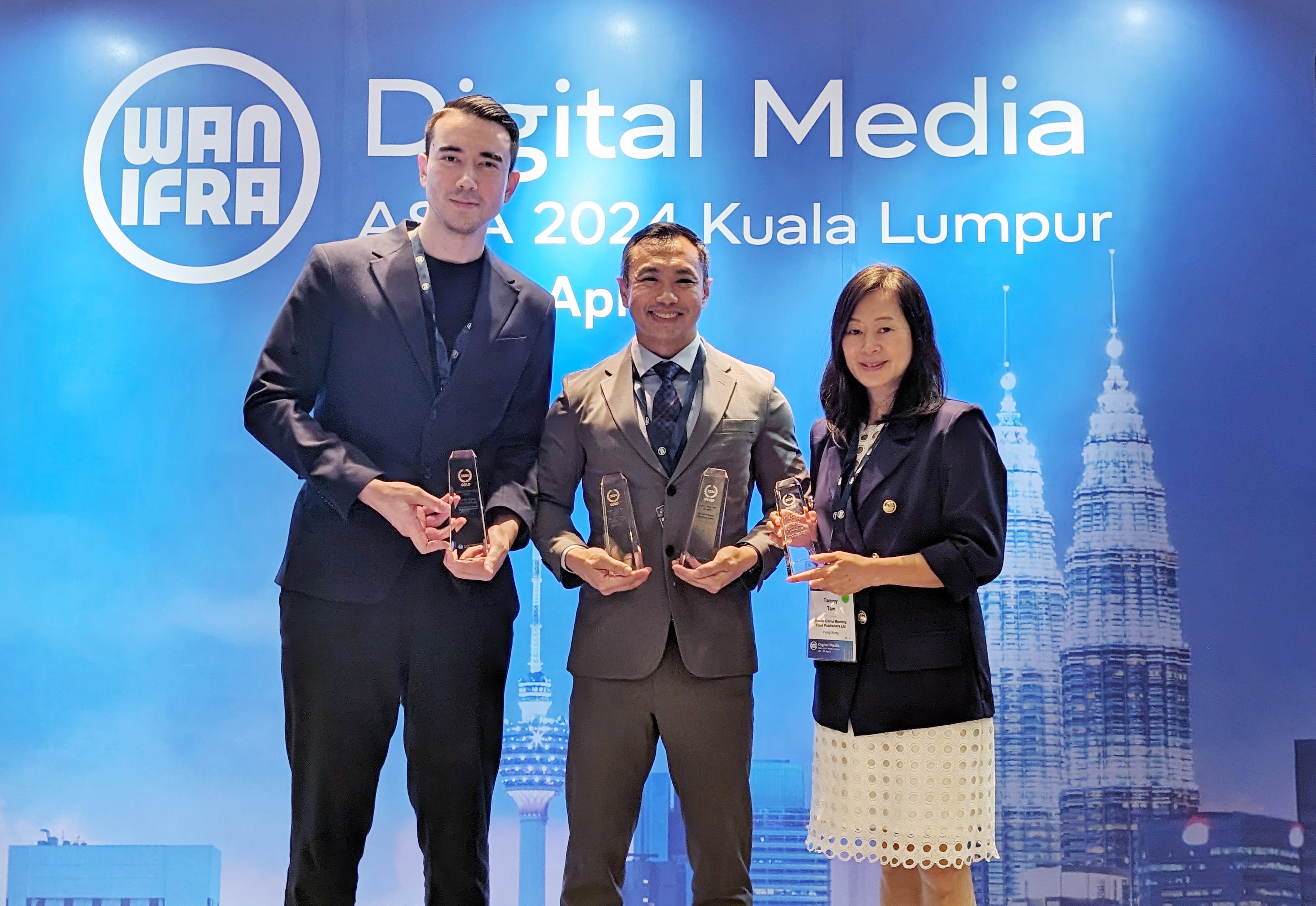 Post digital editor Shea Driscoll (left), director of video Chieu Luu and editor-in-chief Tammy Tam pick up the prizes at the WAN-IFRA awards in Malaysia. Photo: Handout