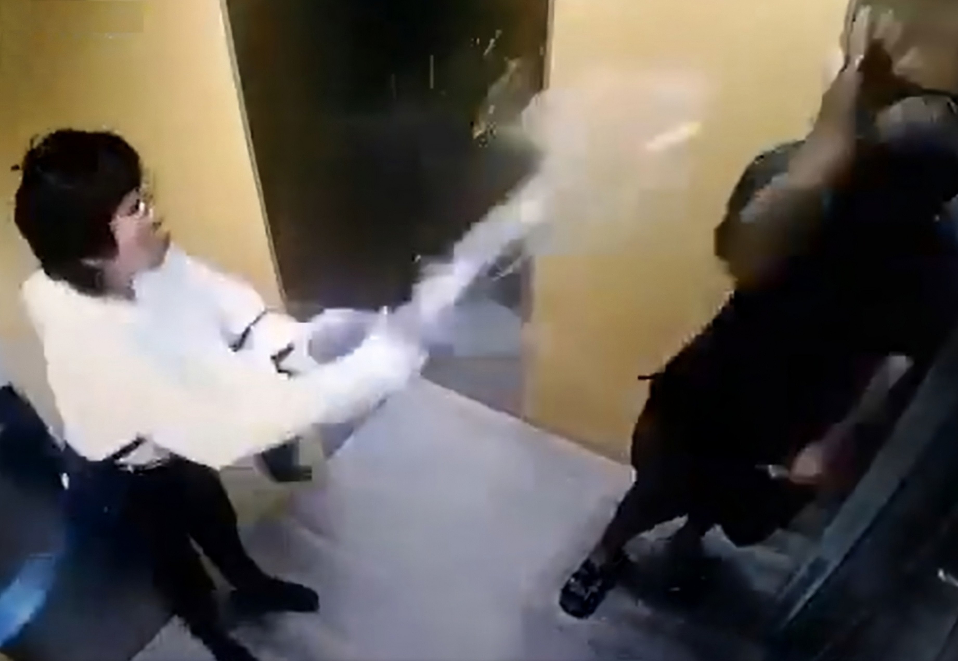 A still taken from surveillance footage shows the moment Oo Saw Kee threw scalding-hot water over a man with Down’s syndrome inside a lift in Malaysia on Friday. Photo: X/Ian_Collins_03