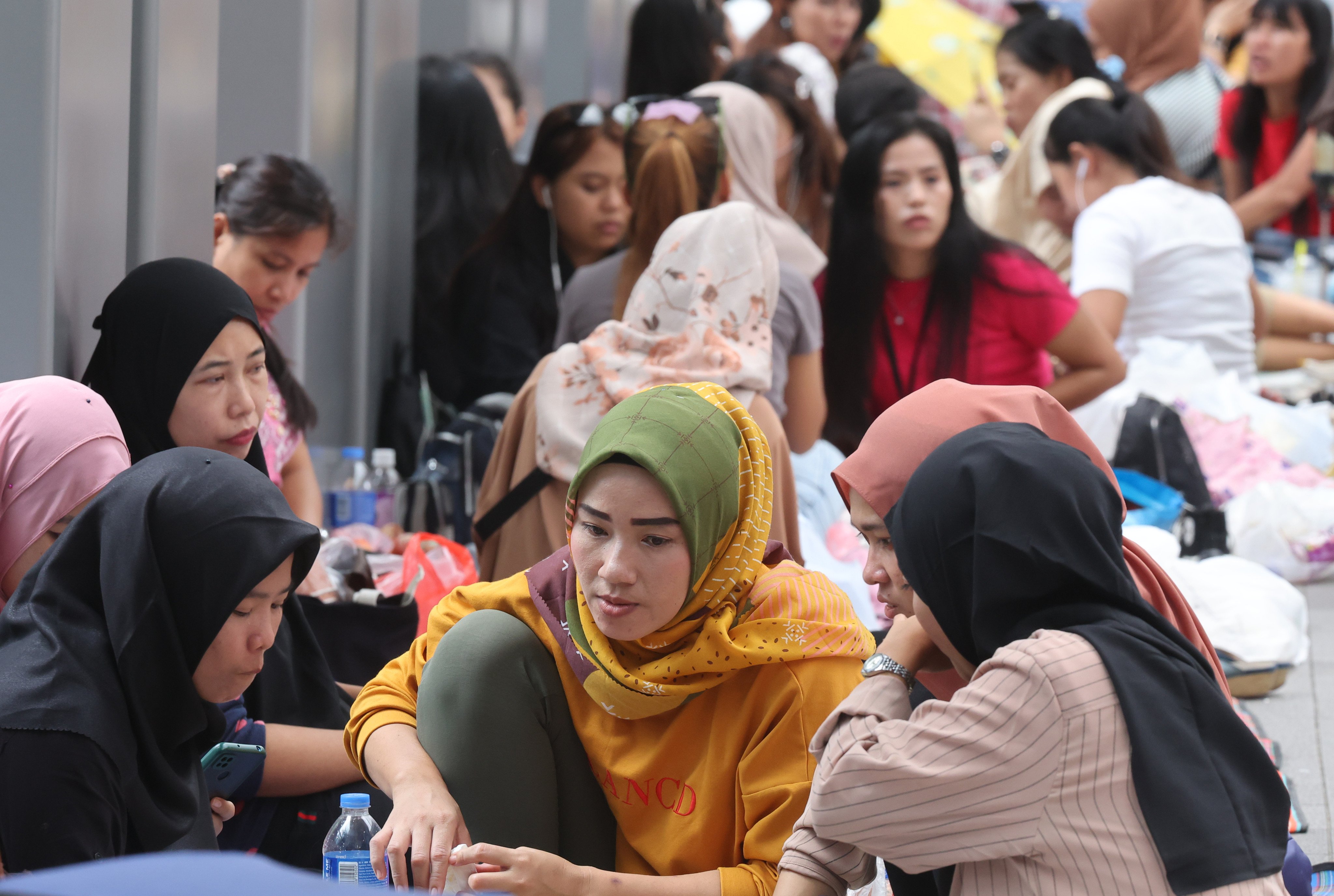 Indonesian domestic helpers gather during their day off at Mong Kok. Photo: Edmond So