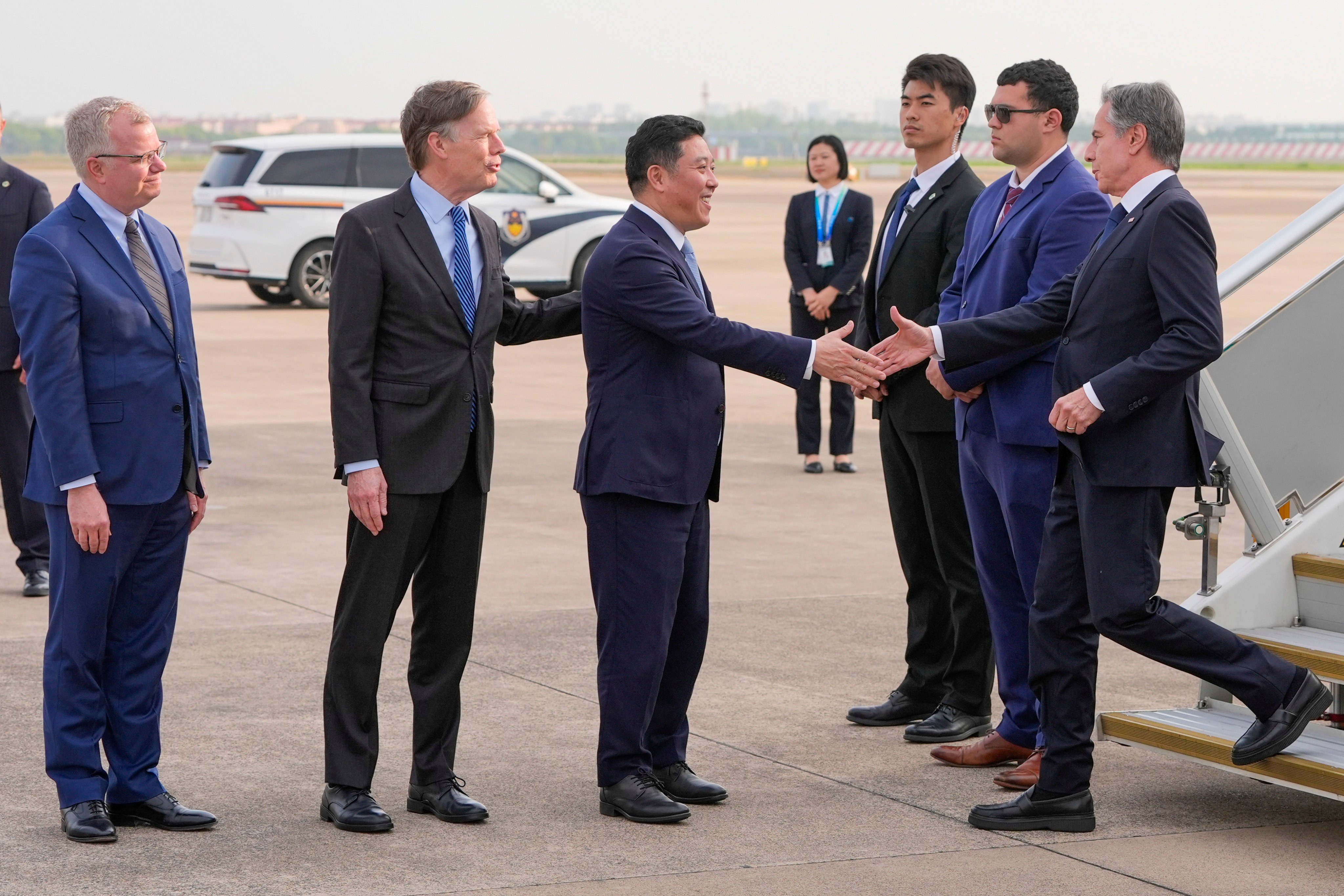 US Secretary of State Antony Blinken is greeted at the airport by Kong Fuan, director general of the Shanghai Foreign Affairs Office, as US ambassador to China Nicholas Burns and the US consul general in Shanghai,  Scott Walker, look on, in Shanghai on April 24. Photo: AP