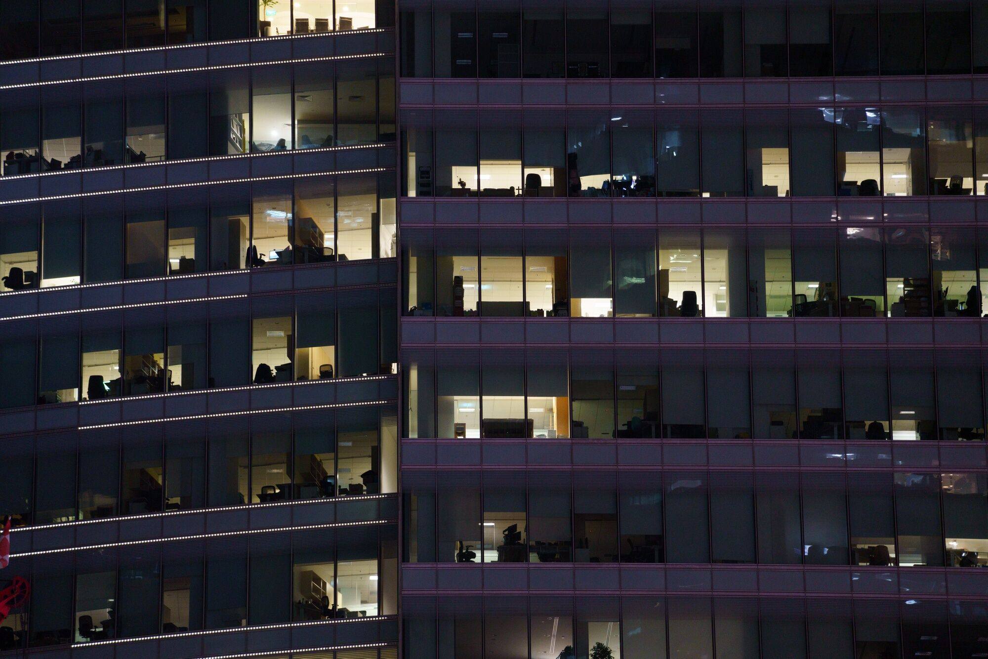 Empty offices are seen at night in the central business district of Singapore. The survey found workers were prioritising work-life balance over their salaries, even amid elevated inflation and the rising cost of living. Photo: Bloomberg