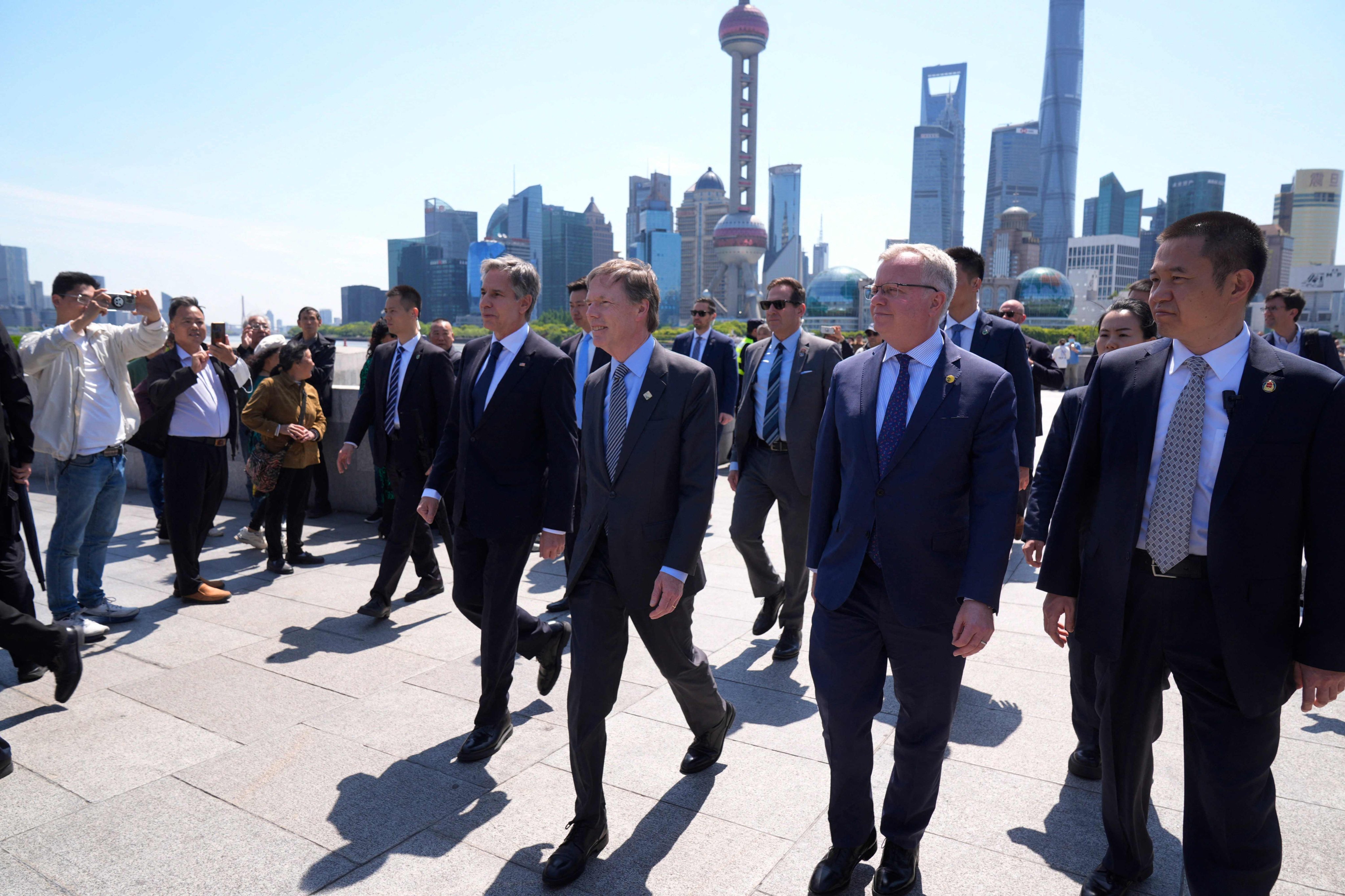 US Secretary of State Antony Blinken walks along Shanghai’s Bund with US ambassador Nicholas Burns (third right) and Shanghai consul general Scott Walker (second right). Photo: AFP