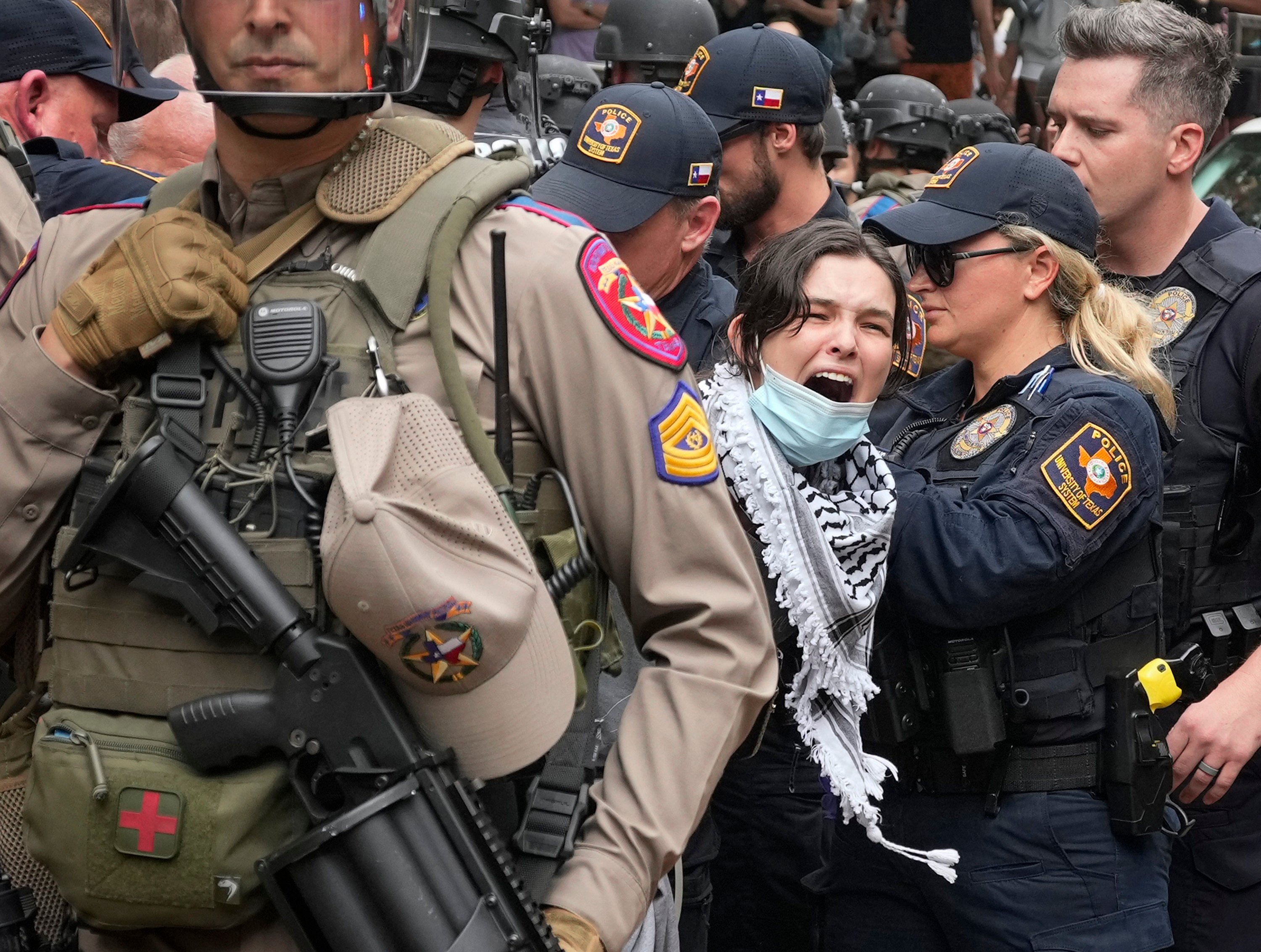 A woman being arrested at a pro-Palestinian protest at the University of Texas. Photo: Austin American-Statesman via AP