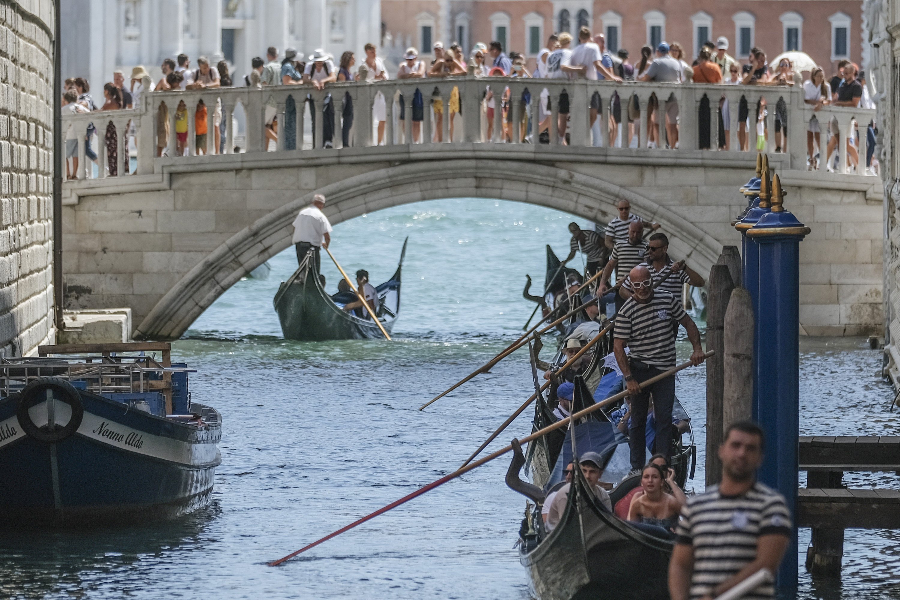 Gondoliers proceed slowly near the crowded Sospiri Bridge close to St Mark’s Square in Venice because of heavy water traffic. The city this week began charging day-trippers for entry, the latest measure by a European tourist destination to try to control visitor numbers. Photo: Getty Images