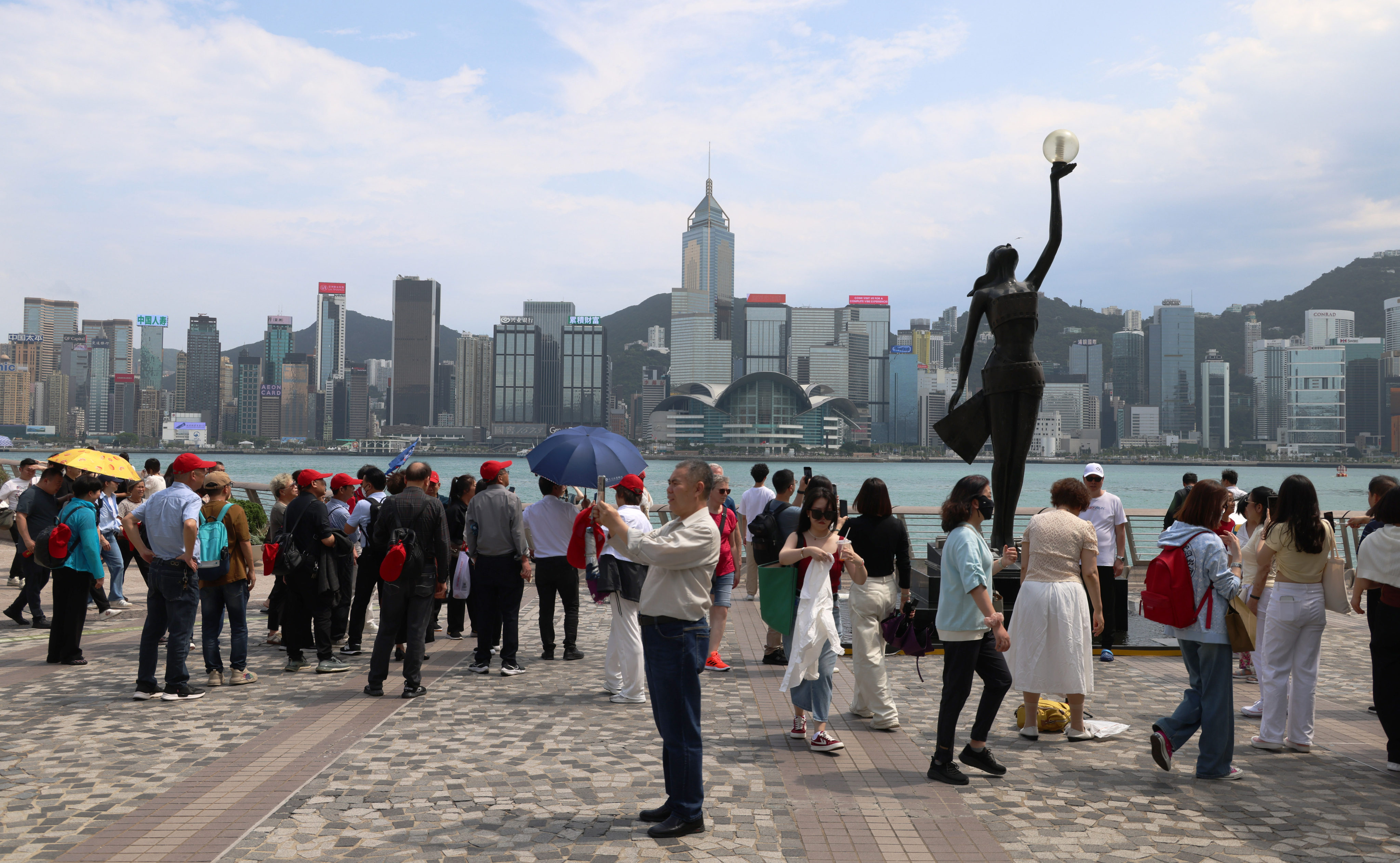 Tourists flock to the Tsim Sha Tsui waterfront, expected to be a top attraction for the Labour Day “golden week” holiday. Photo: Jelly Tse