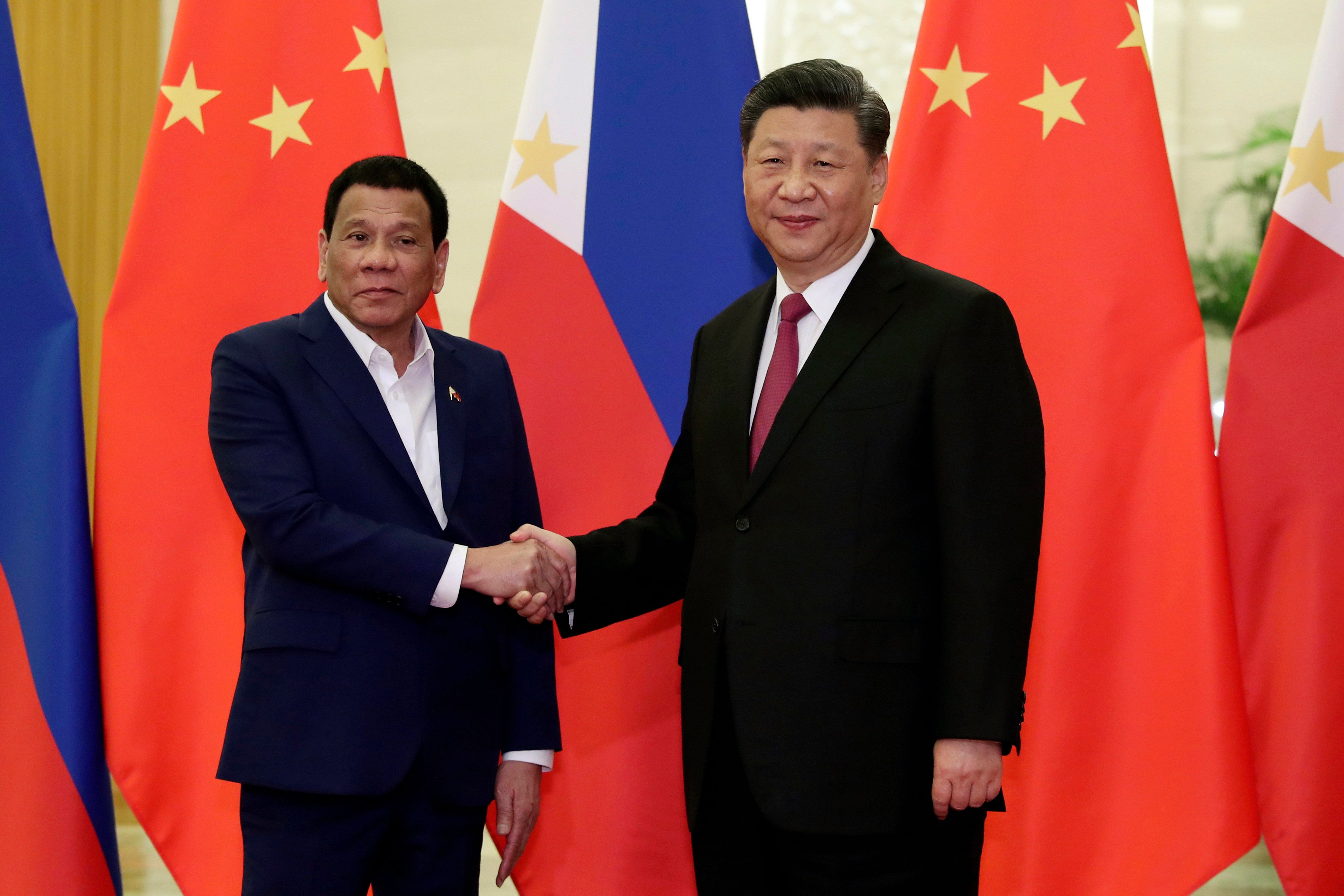 Rodrigo Duterte, then Philippine president, and Chinese President Xi Jinping shake hands before a meeting at the Great Hall of the People in Beijing on April 25, 2019. Photo: AP