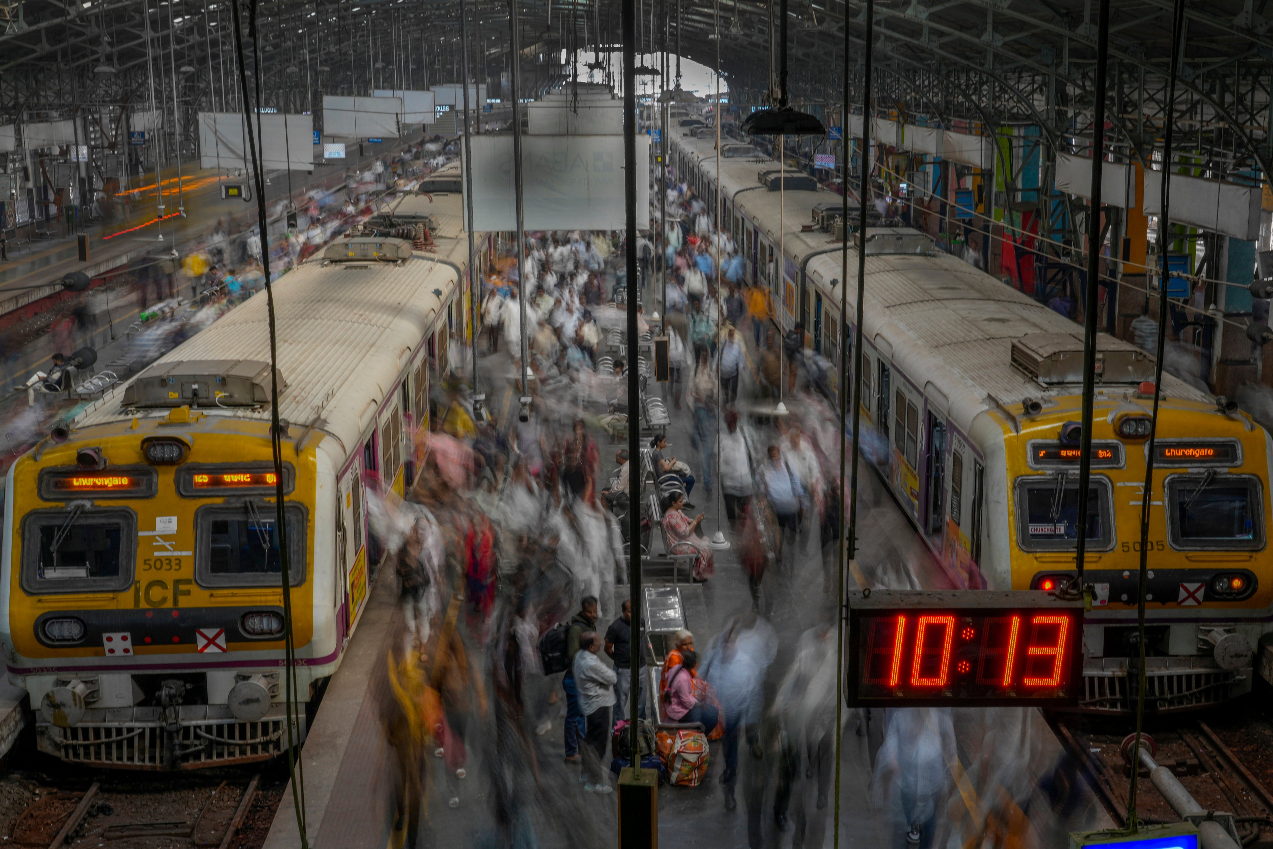 Indian commuters get off trains at the Church Gate railway station in Mumbai, India. The country saw a record 411 million passengers in the first three weeks in April. Photo: AP