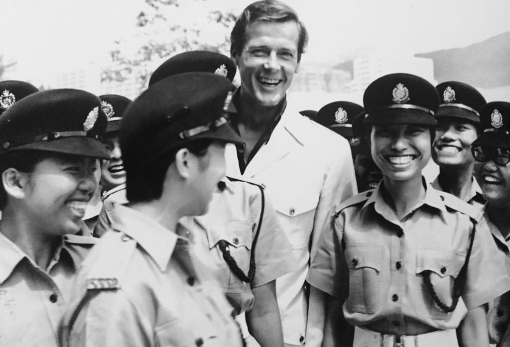 Roger Moore with policemen in Hong Kong, 1974. Photo: GIS/Handout