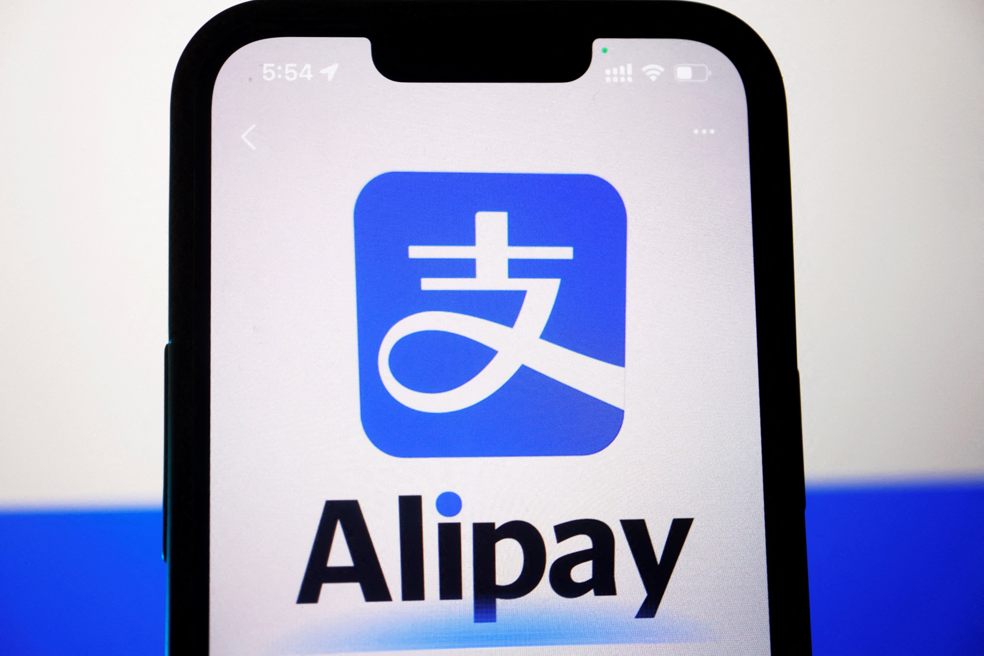 The logo of Alipay is seen through the camera of the app on a mobile phone, in this illustration picture. Photo:Reuters