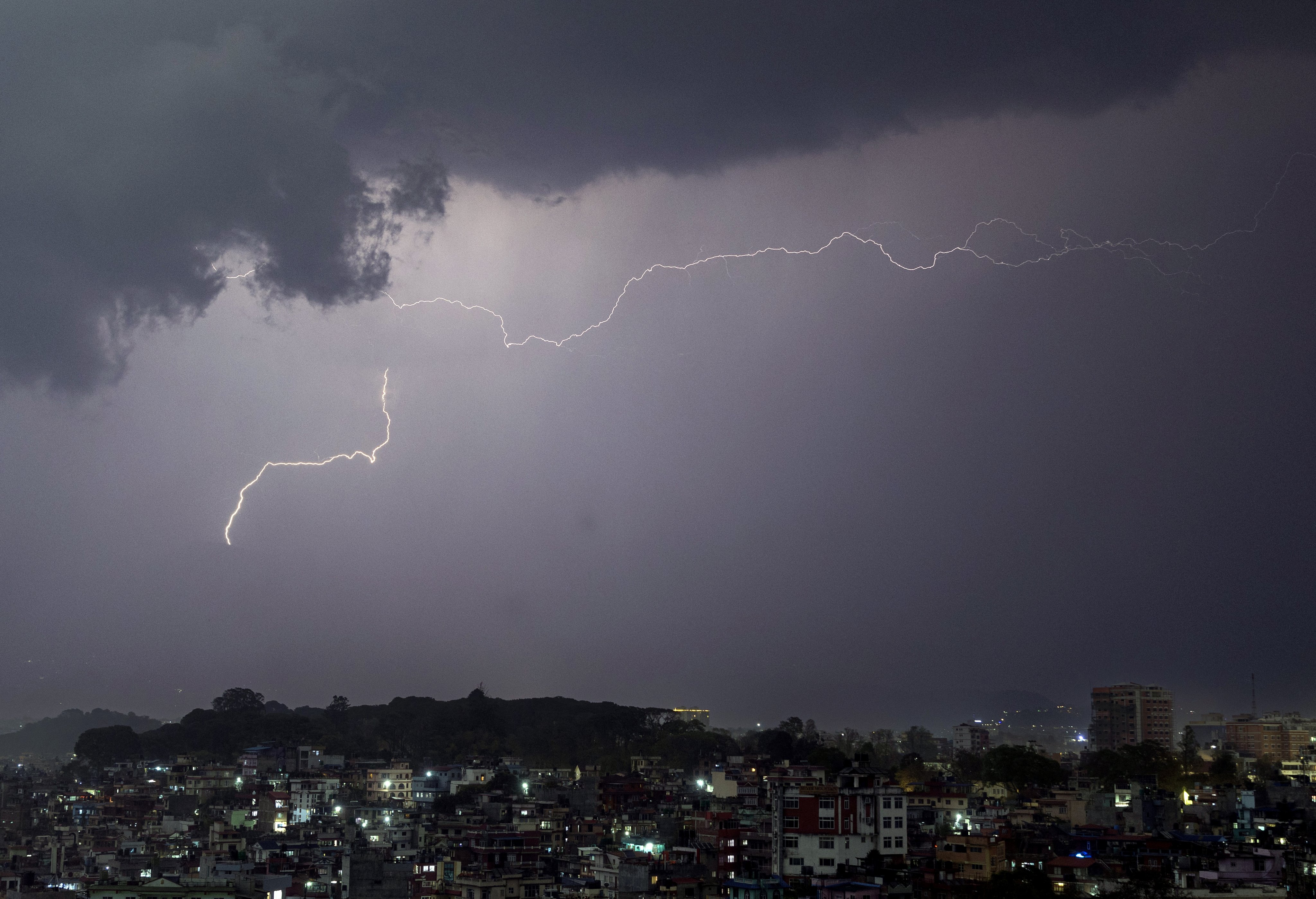 Lightning flashes through the night sky over Kathmandu Valley in Nepal during a heavy storm on March, 31. Photo: EPA-EFE