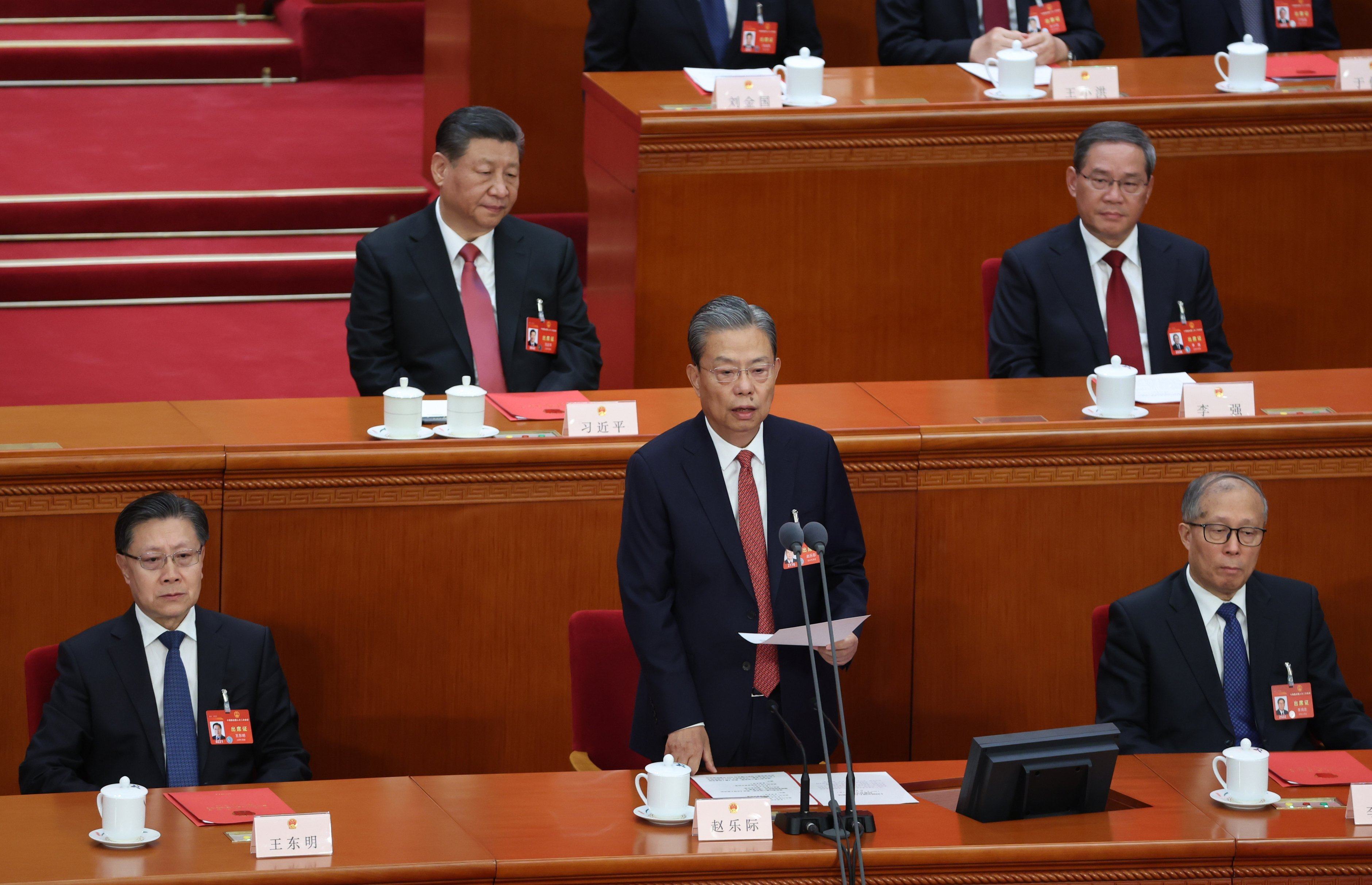 National People’s Congress Standing Committee Chairman Zhao Leji speaks as President Xi Jinping and Premier Li Qiang listen. Photo: EPA