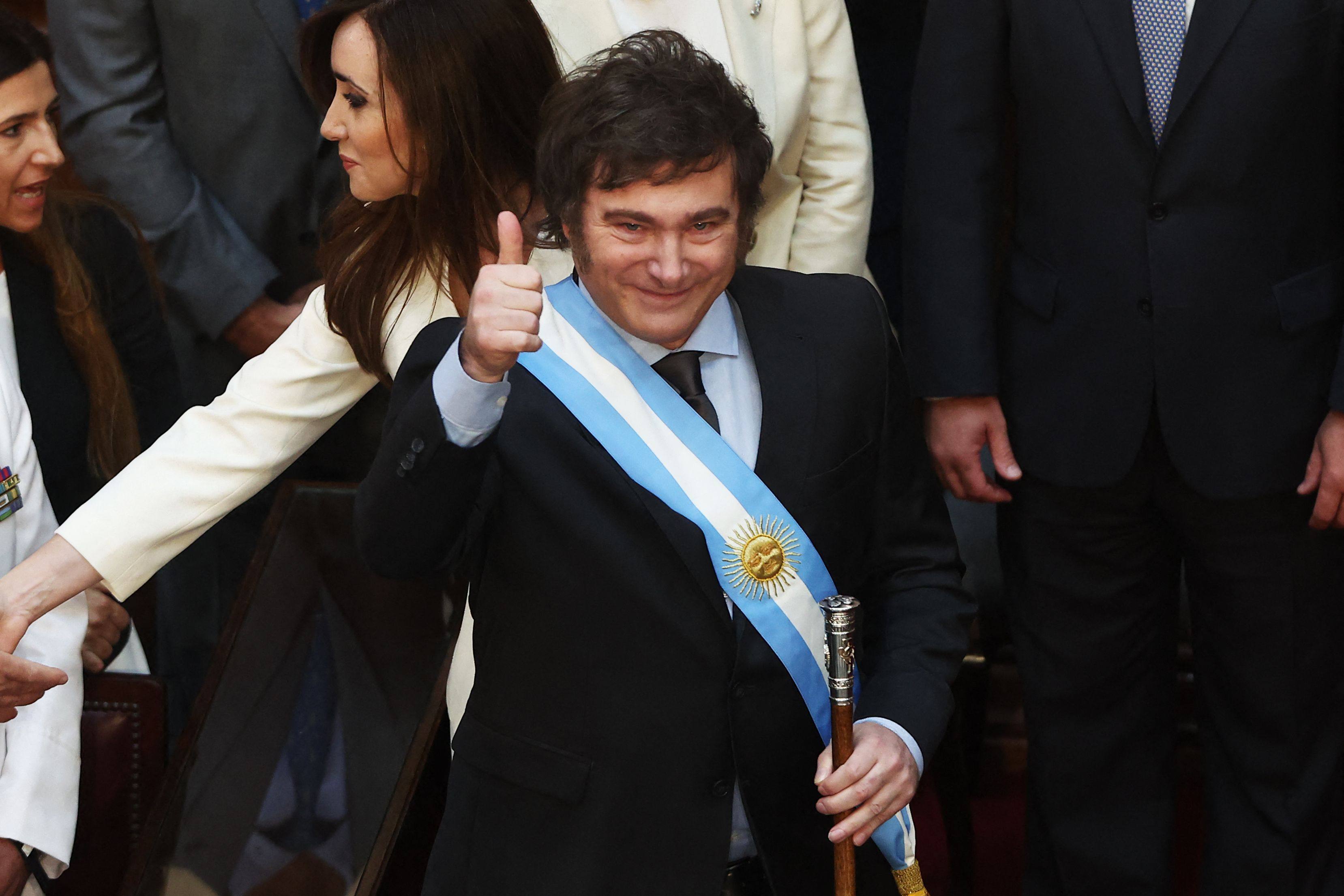 Argentina’s Javier Milei gives the thumb up after receiving the presidential sash and baton during his inauguration ceremony at the Congress in Buenos Aires in December 2023. Photo: AFP
