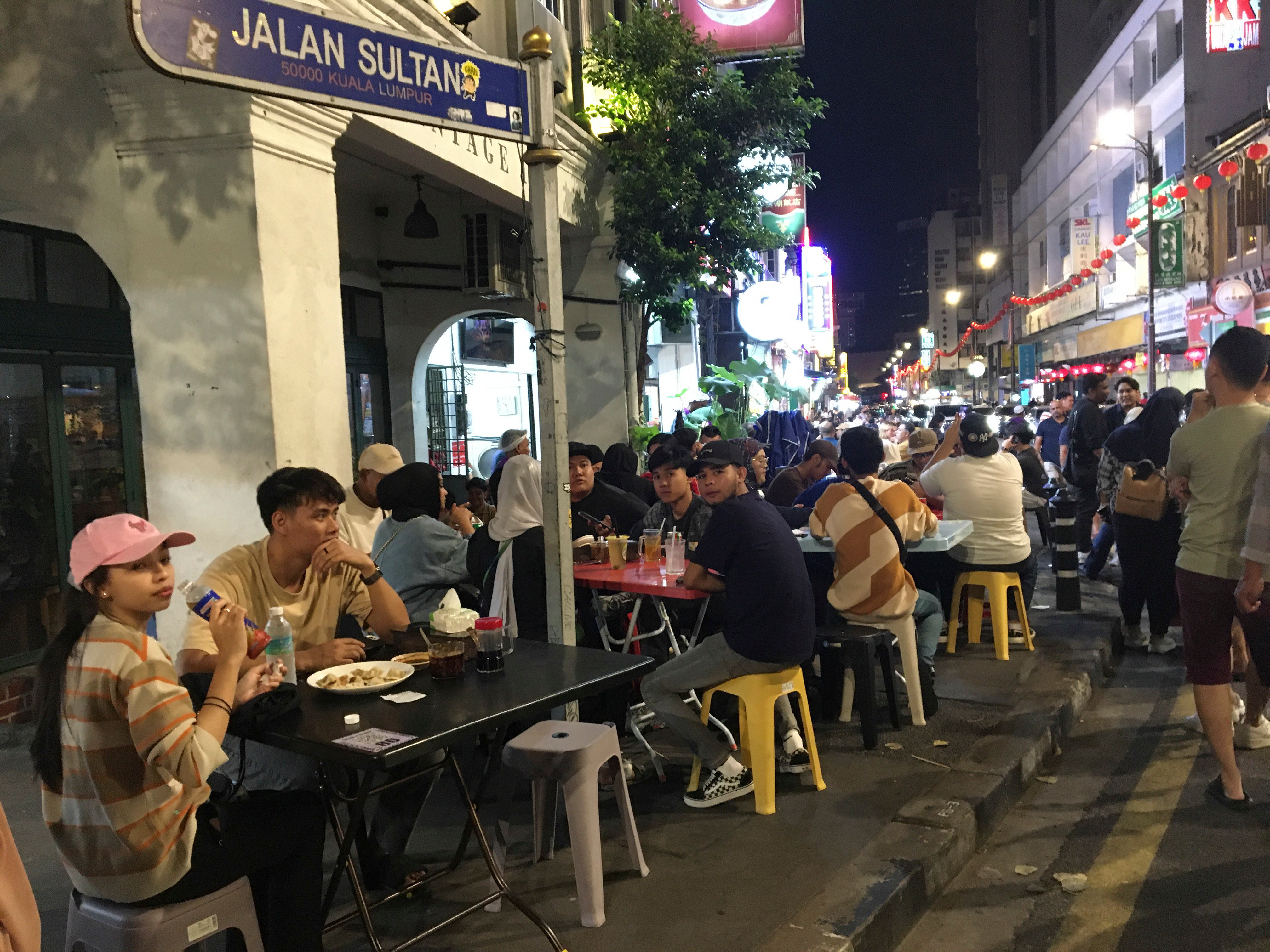 Street side eateries in Kuala Lumpur’s Chinatown, Malaysia, 2024. Photo: John Brunton