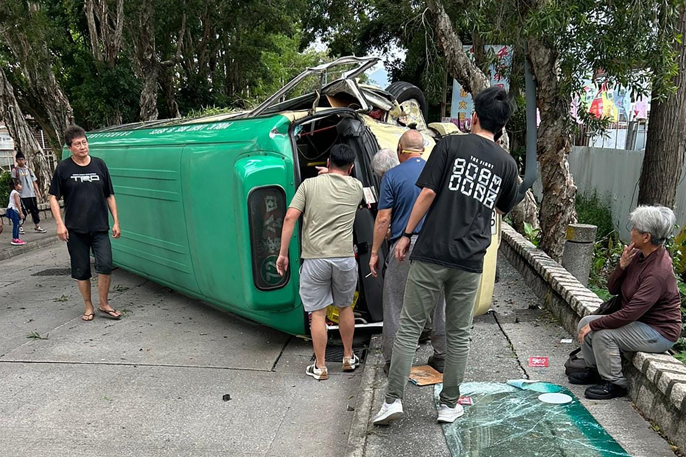 The minibus flipped over after hitting a lamp post following the crash. Photo: Facebook / @ Keylex Chow