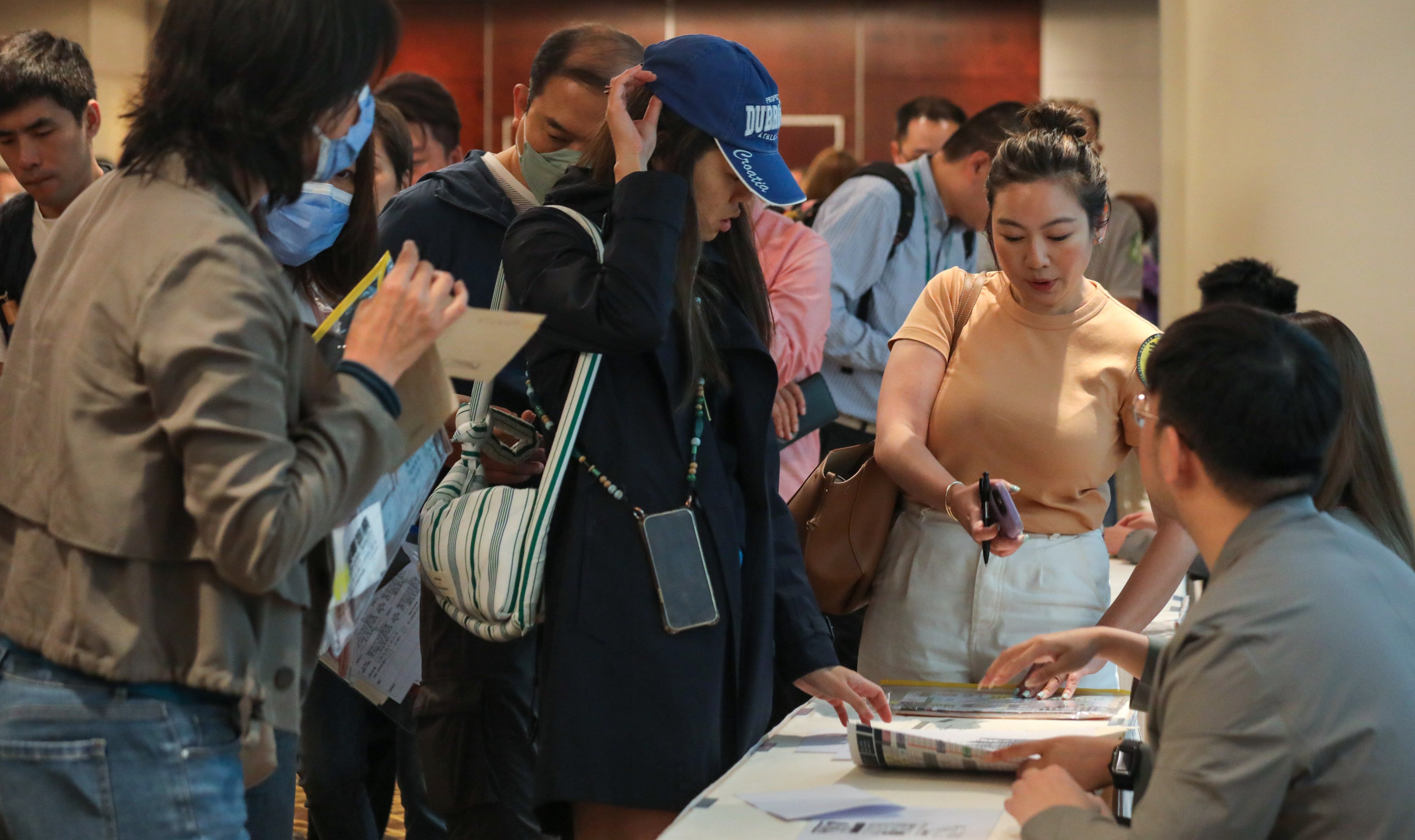 Prospective buyers queue up at the Mong Kok sales office of Great Eagle Holdings’ Onmantin residential project on April 27, 2024. Photo: Xiaomei Chen