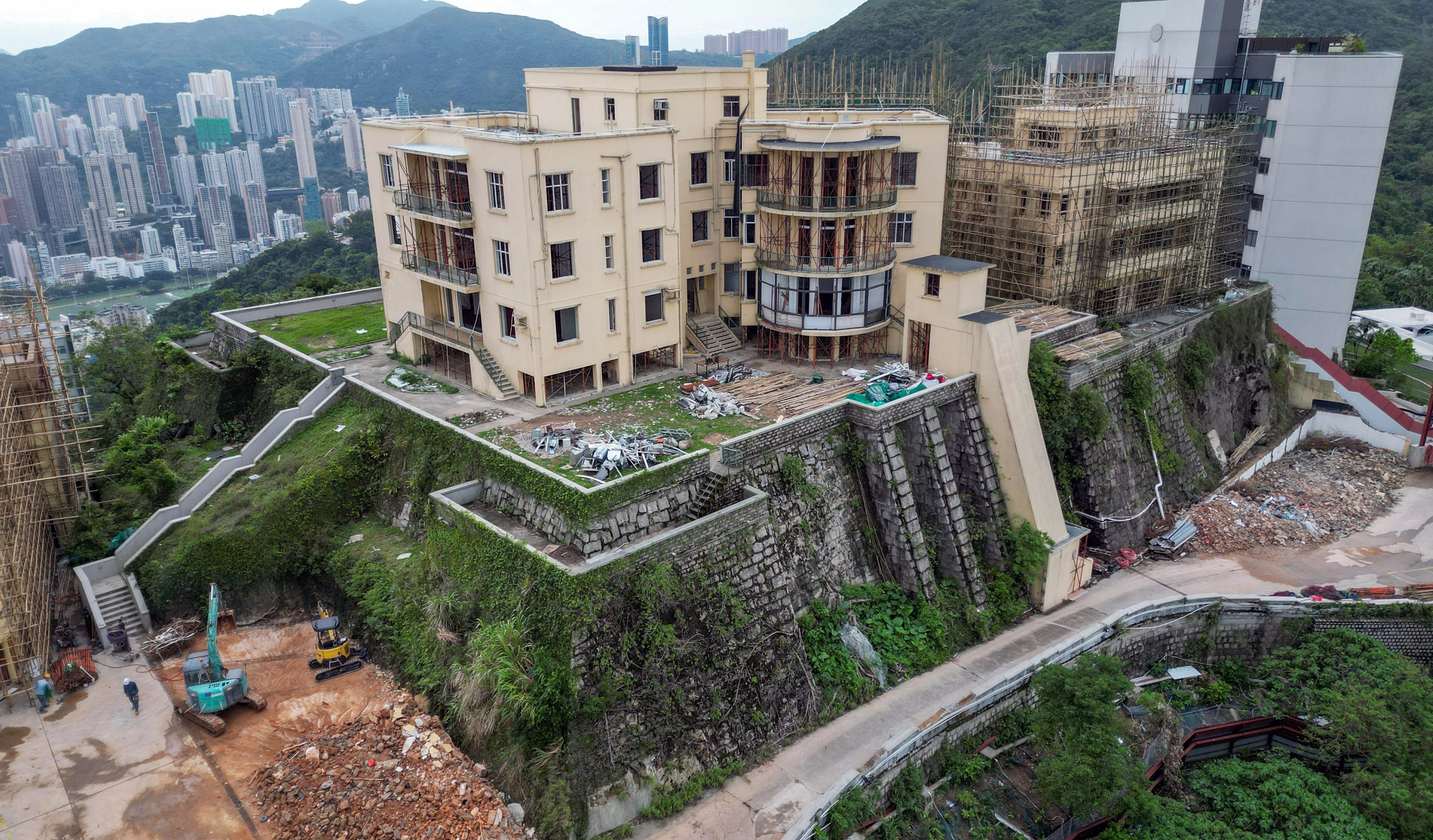 Construction is under way at the decades-old residential blocks Cameron Mansions, which is build on a former Japanese war memorial site. Photo: Dickson Lee