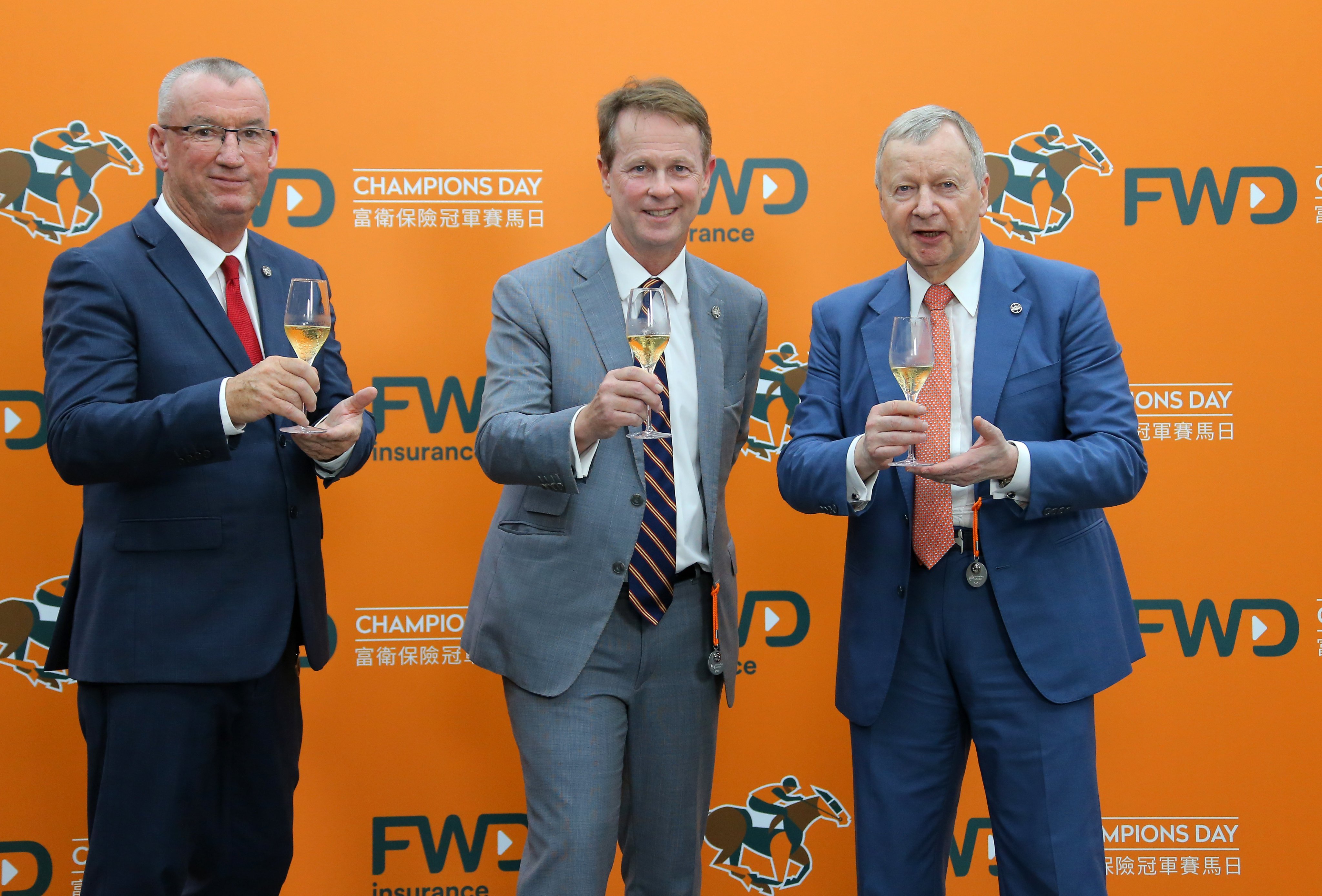 Jockey Club officials Greg Carpenter (left), Andrew Harding and Winfried Engelbrecht-Bresges toast Champions Day. Photos: Kenneth Chan