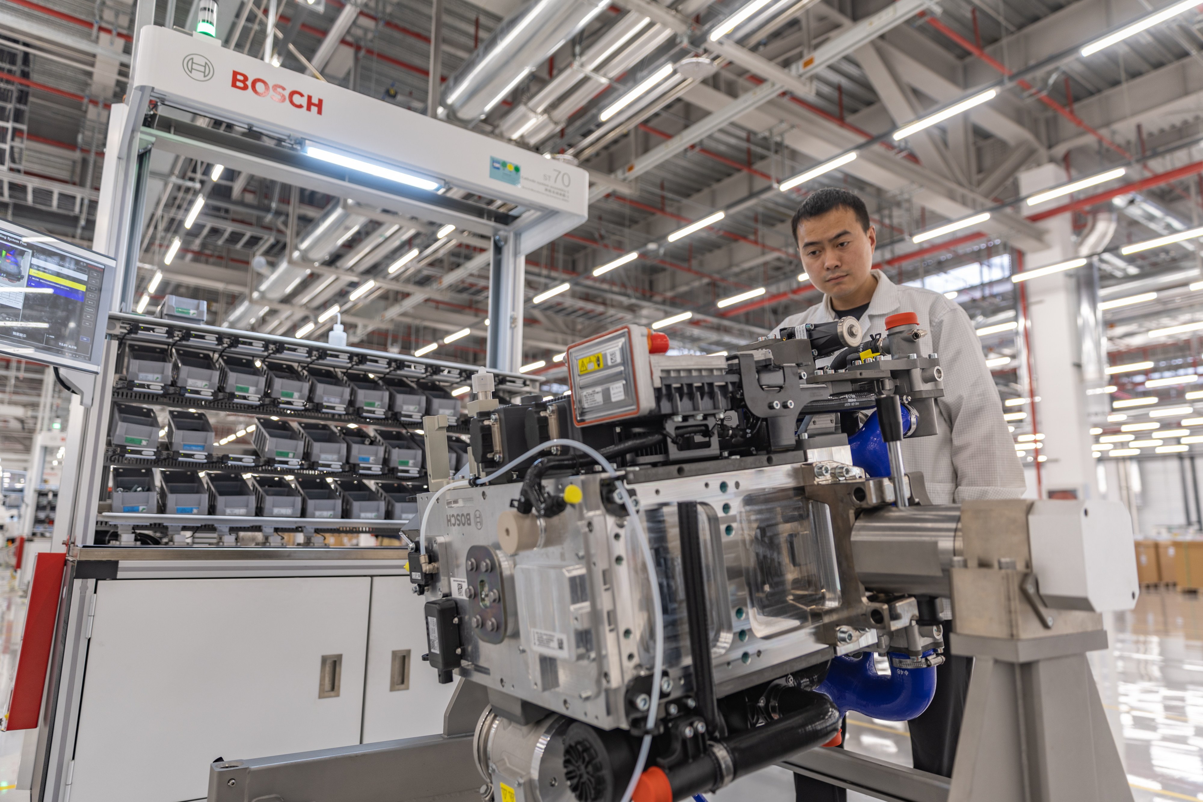 A worker operates equipment at Bosch Hydrogen Powertrain Systems, a Chinese-German joint venture in Chongqing, on April 14. China may emerge as a powerful player in the hydrogen economy next. Photo: Xinhua  