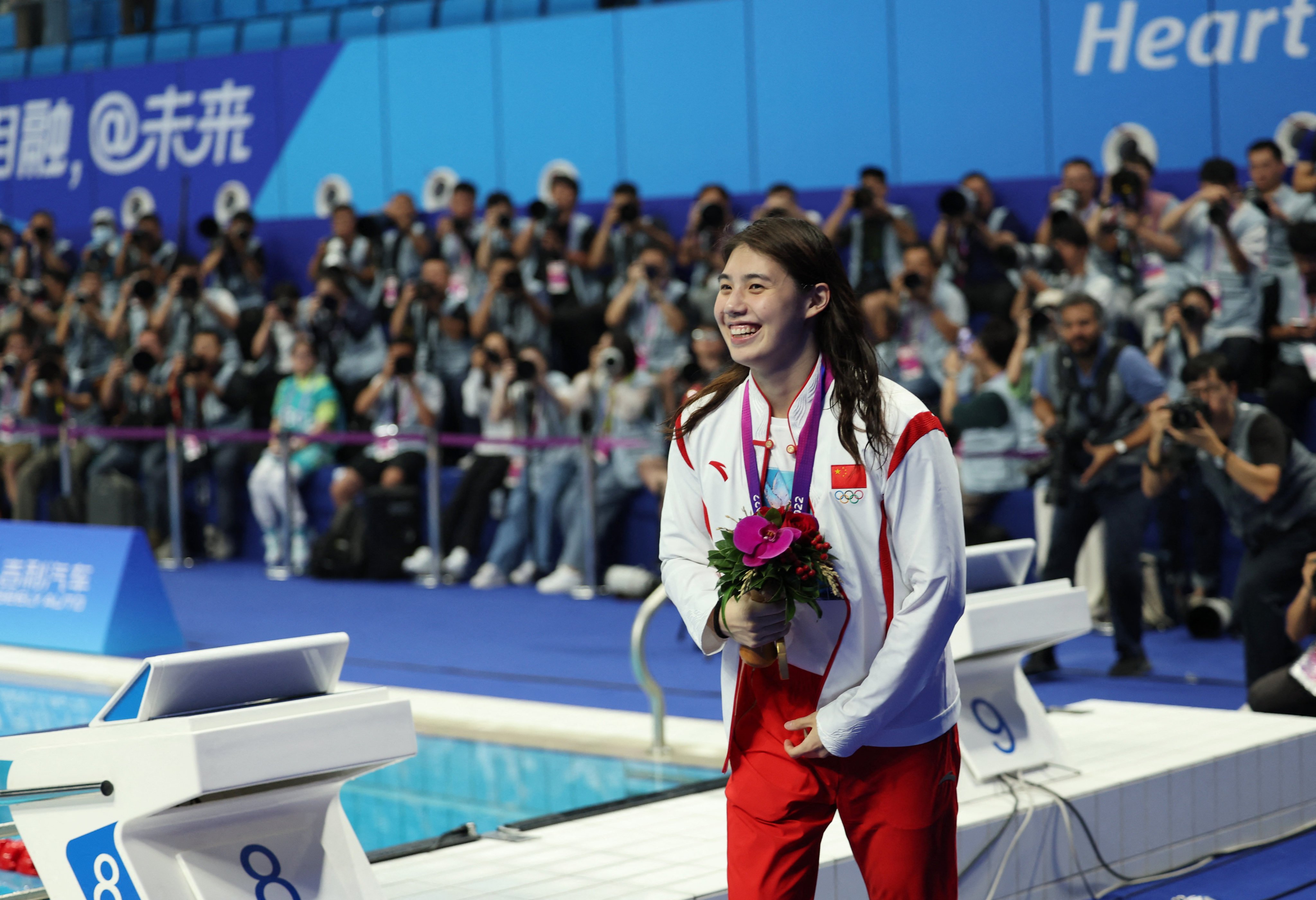 Asian Games gold medallist Tang Qianting set a new mark in the 100m breaststroke. Photo: Reuters