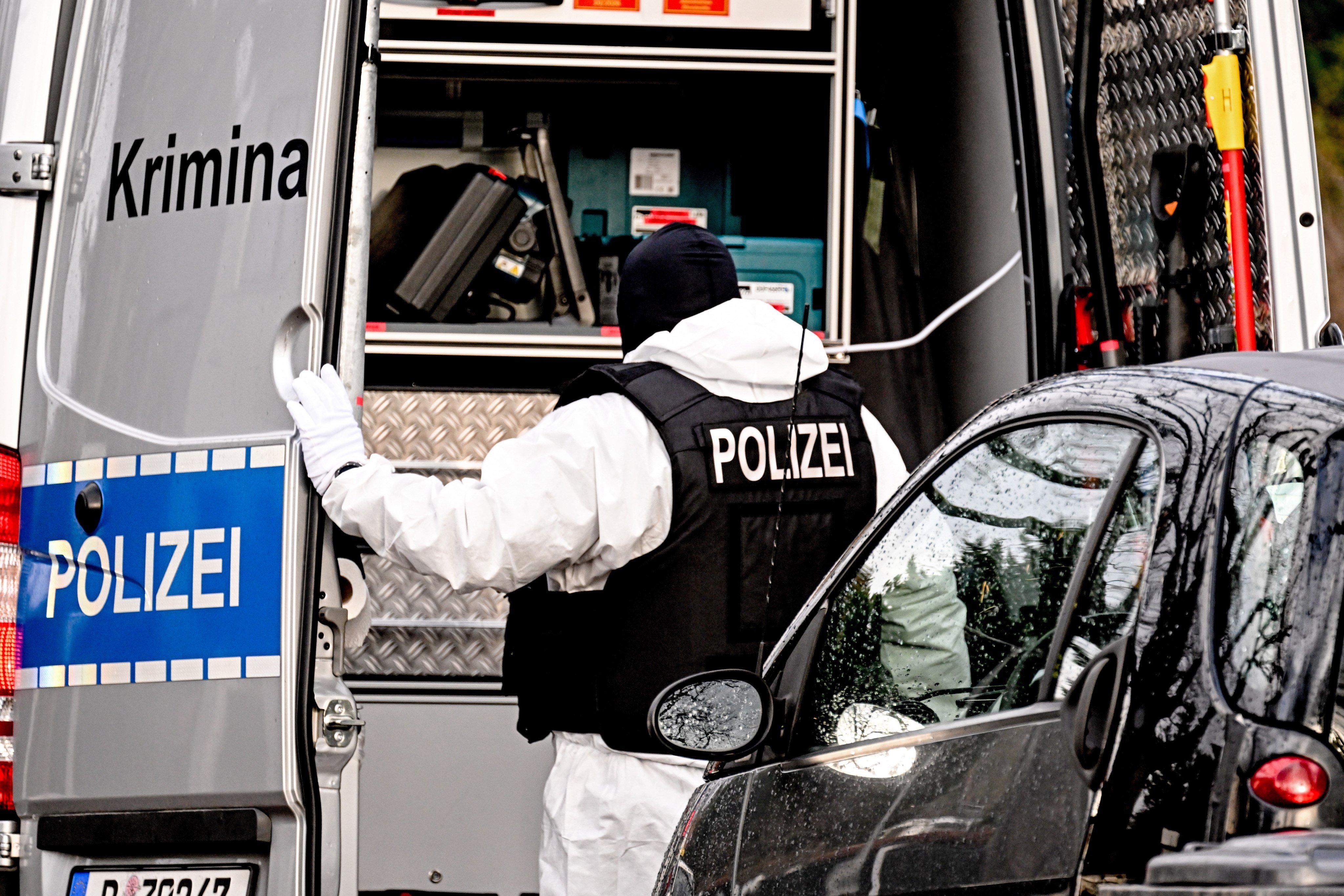 A police officer during a raid in Berlin, Germany in December 2022. Nine people charged over the 2022 ‘Reichsbuerger’ coup will go on trial on Monday. Photo: EPA-EFE