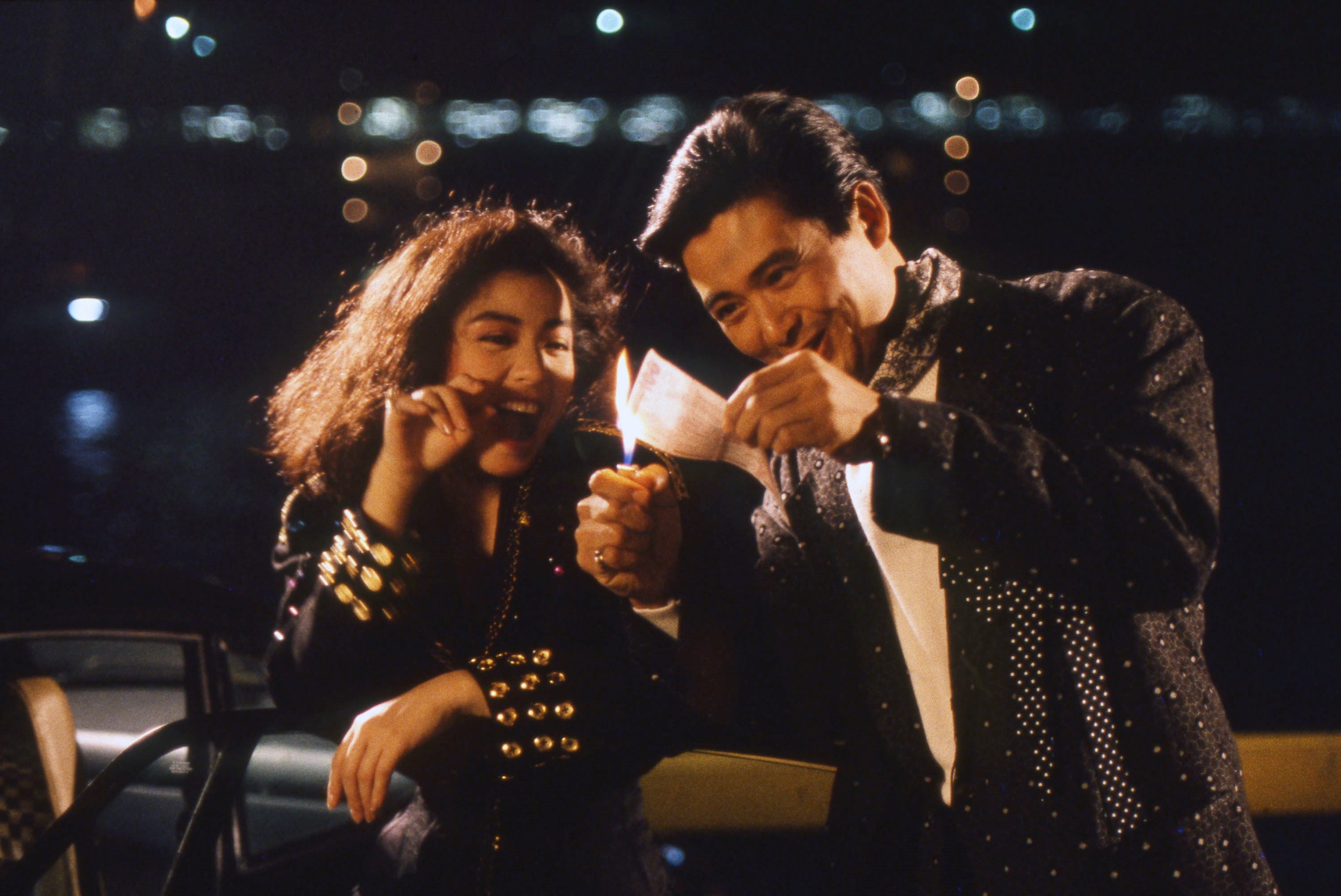 Chow Yun-fat and Cherie Chung film a scene in Tsim Sha Tsui for The Eighth Happiness in a photograph shot by Canadian Greg Girard. A collection of his 1980s Hong Kong film set photos will be presented in “Greg Girard: Hong Kong Made Me” at M+ museum. Photo:  M+/Greg Girard