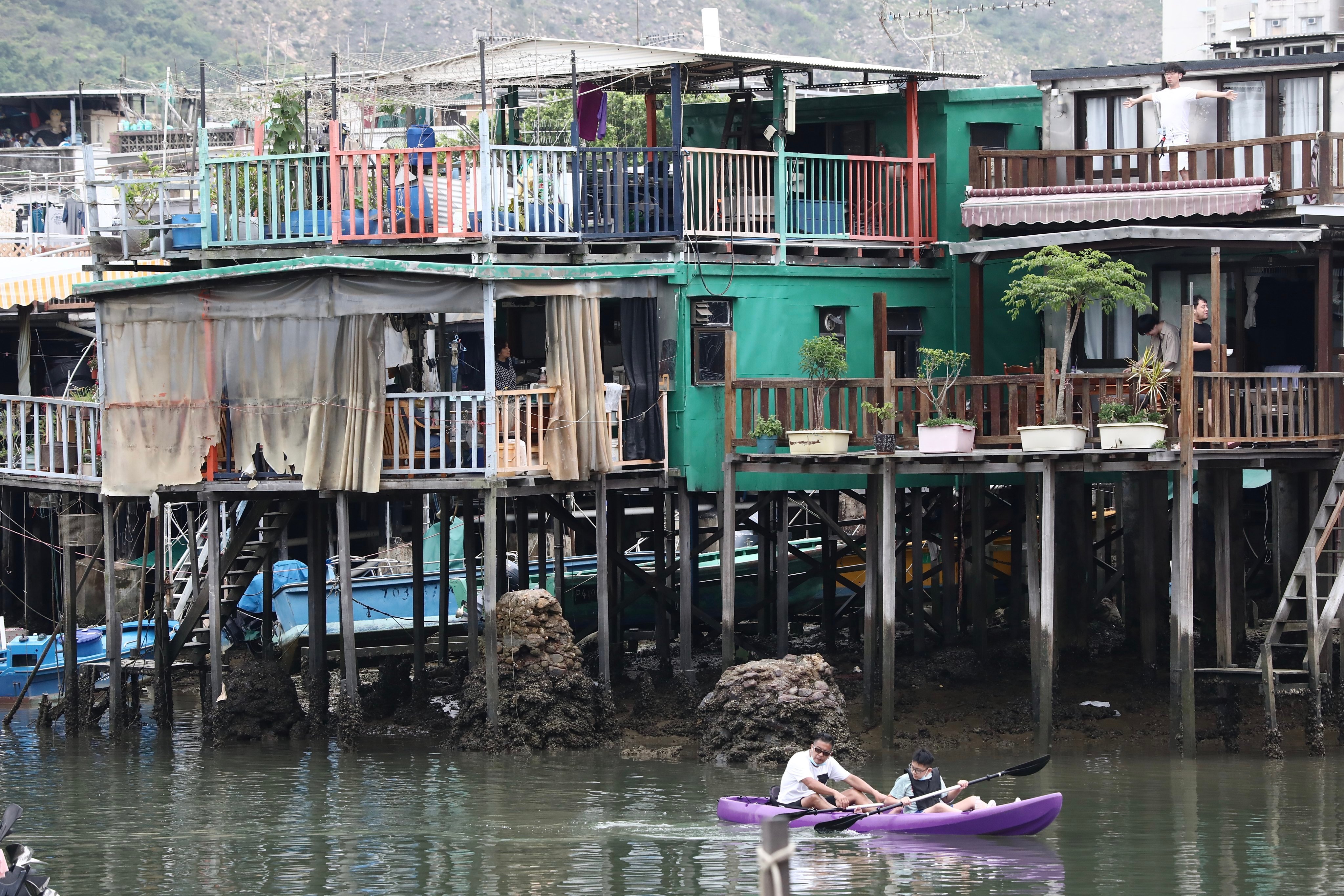 Kayakers pass stilt houses in Tai O, a fishing village on Hong Kong’s Lantau Island. As more young people move away, efforts to preserve its culture and history, such as the opening of the Tai O Heritage Hotel, have kicked in. Photo: Jonathan Wong