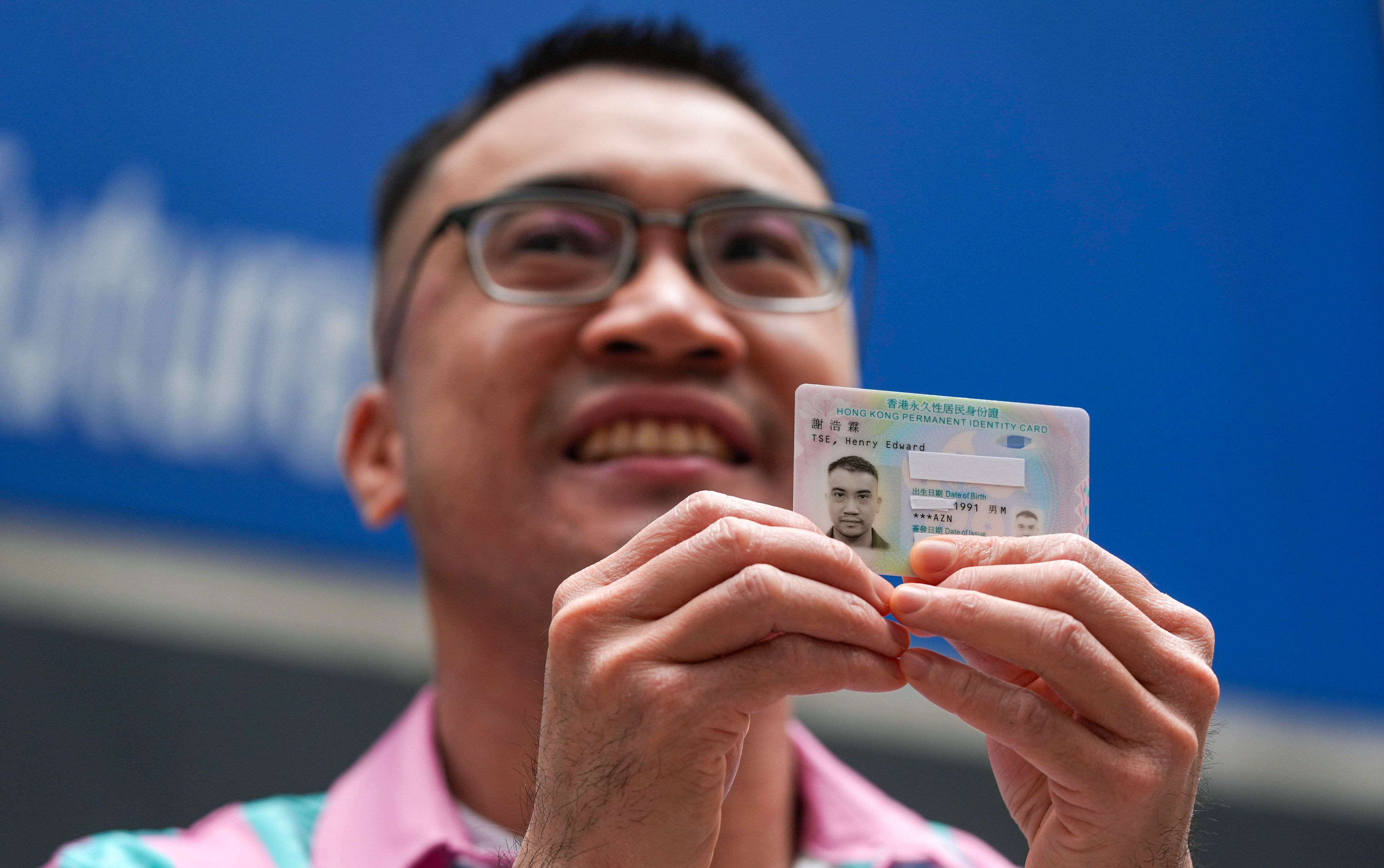 Henry Edward Tse with his new ID card. The transgender activist has vowed to keep up the fight for equality. Photo: Eugene Lee