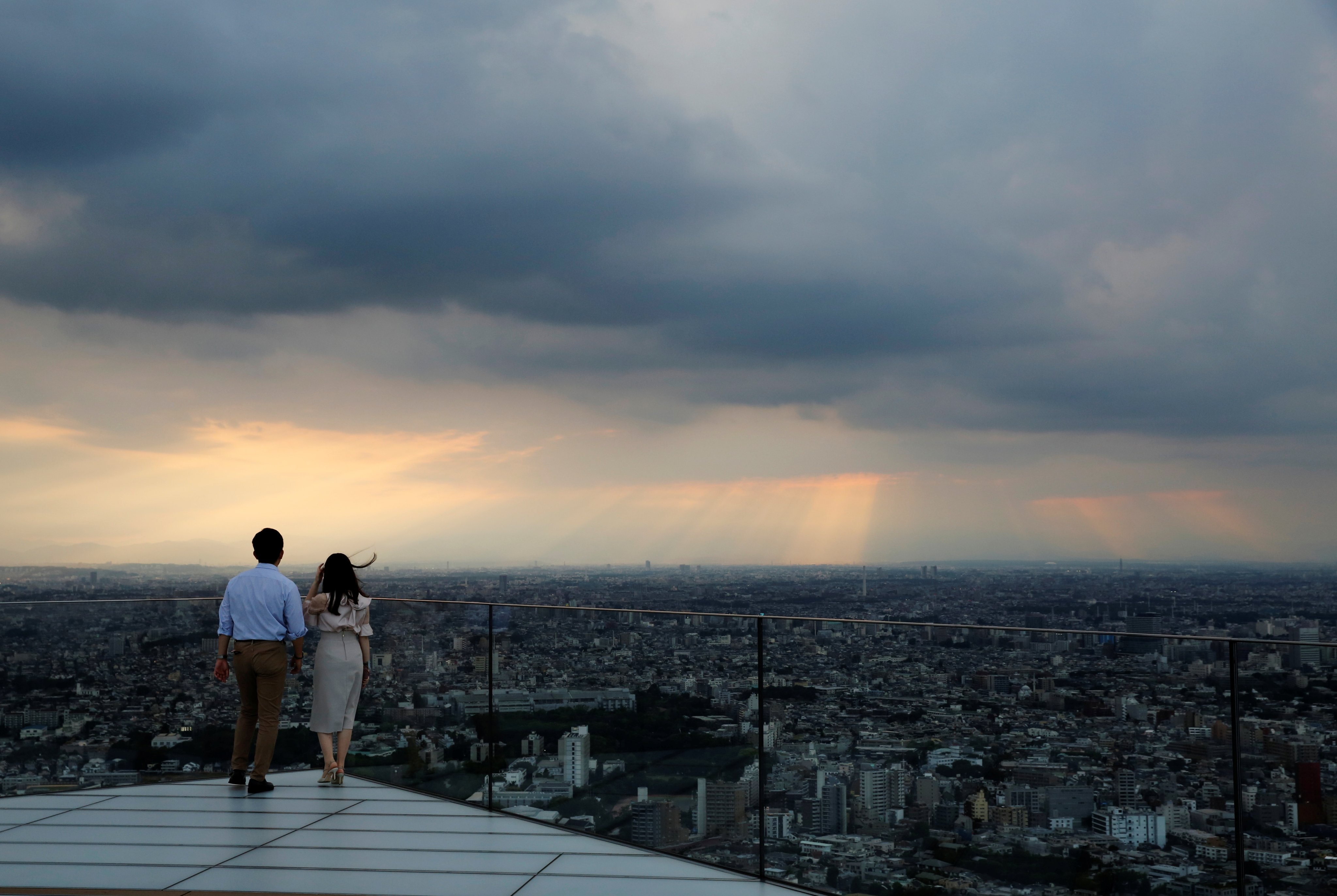 Visitors look out from Shibuya Sky, the observation deck atop Shibuya Scramble Square, in Tokyo, in June 2021. The falling yen has also added to the appeal of Japanese commercial property. Photo: Reuters