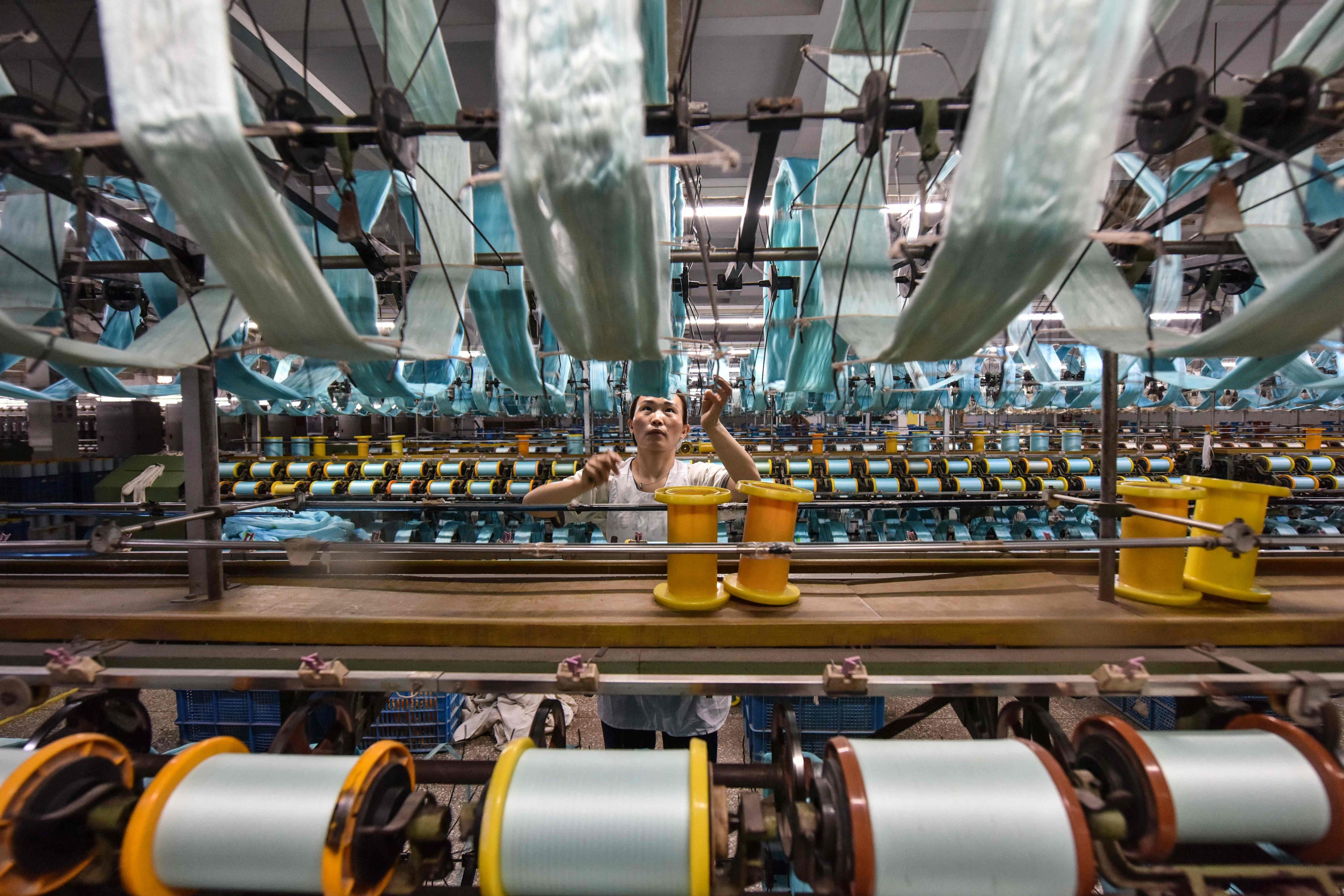 China’s official manufacturing purchasing managers’ index (PMI) stood at 50.4 in April compared to 50.8 in March. Photo: AFP