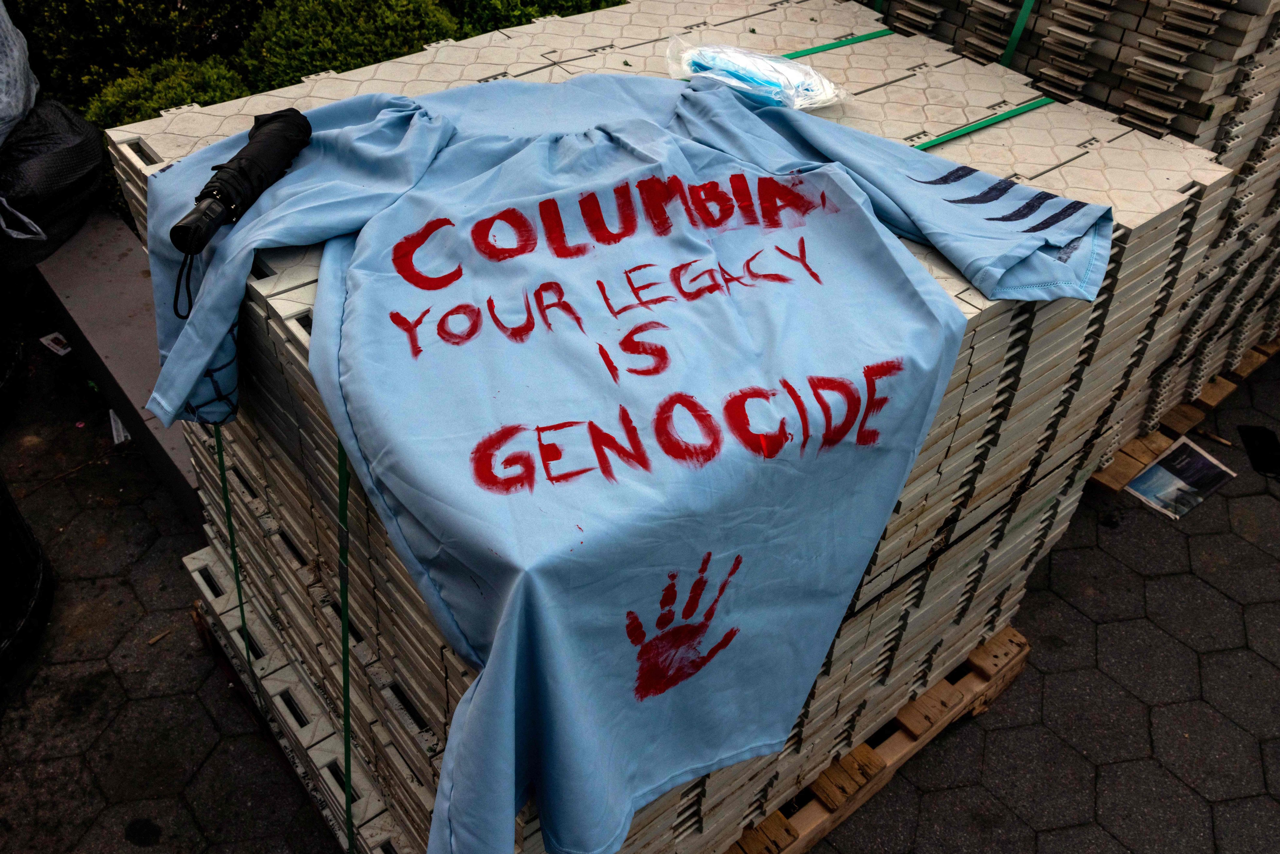 A graduation gown with a message from anti-Israel protestors is left outside the encampment at Columbia University on April 29, 2024. Photo: Getty Images via AFP