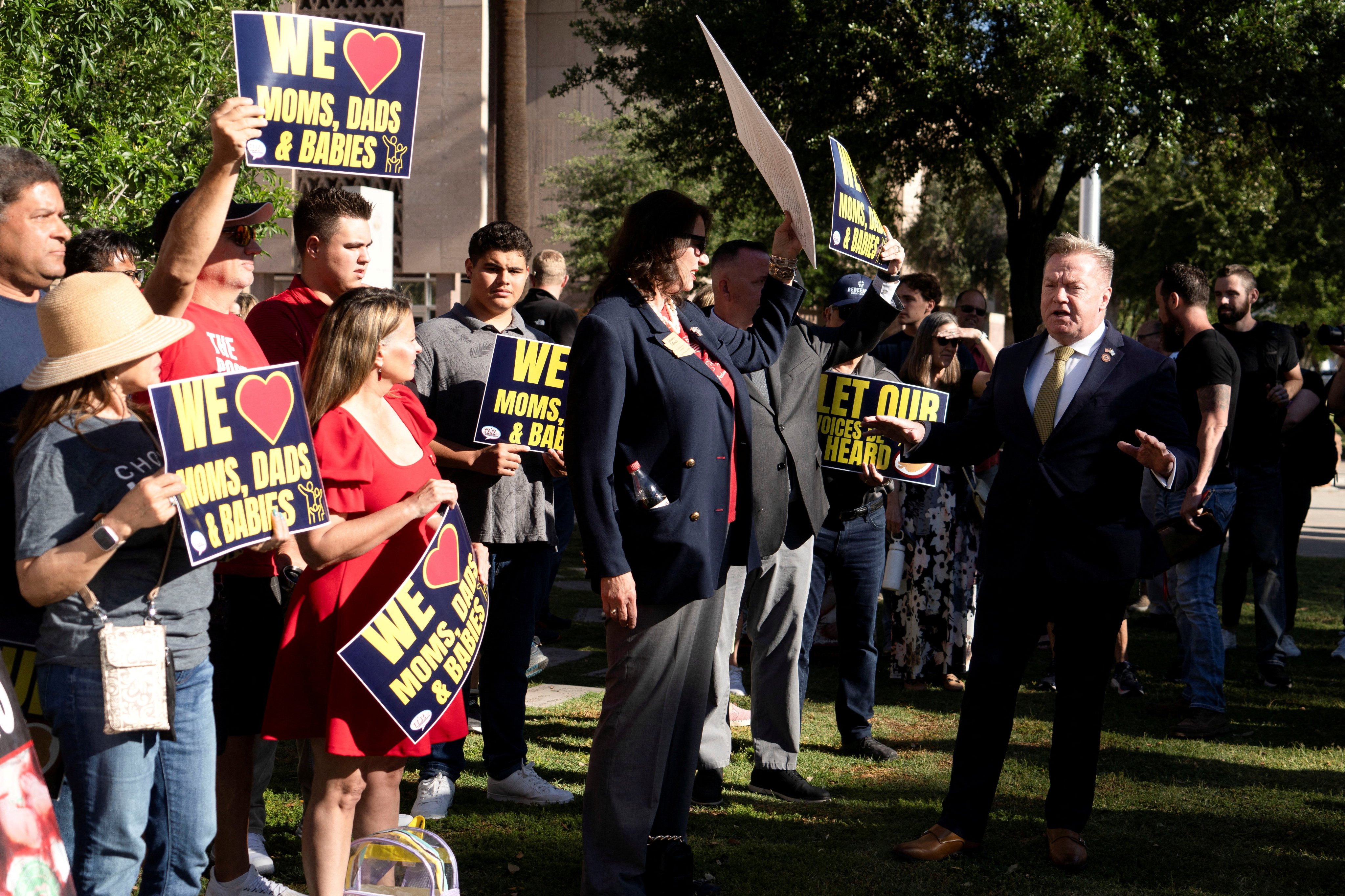 Republican Arizona state senator Anthony Kern (right) speaks with anti-abortion protesters at the Arizona State Capitol. The fight over the Civil War-era abortion ban in Arizona is the latest flashpoint on women’s reproductive rights in the US. Photo: Reuters