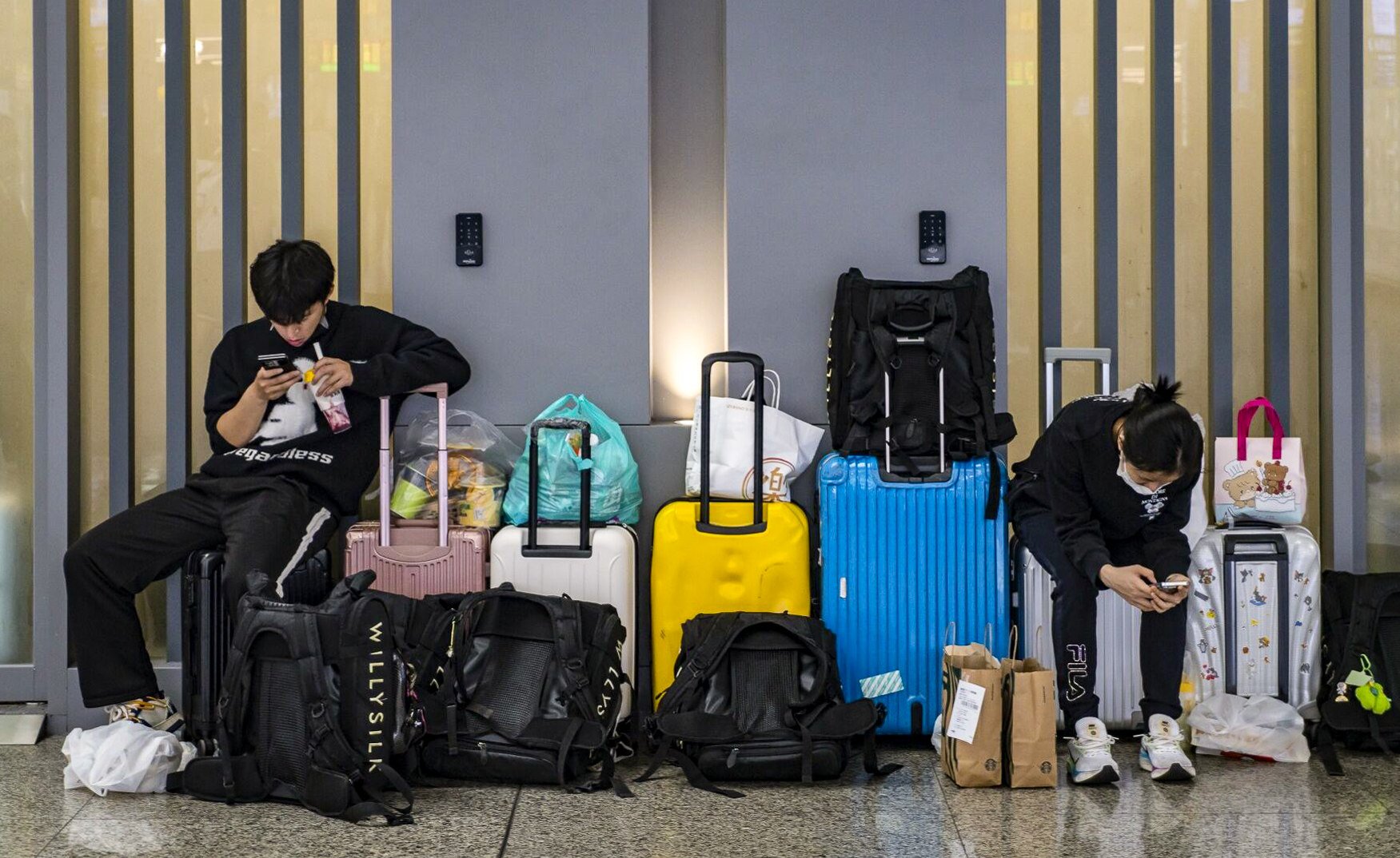 On April 30, travellers wait at Hongqiao High-speed Railway Station ahead of May Day holidays in Shanghai. Some universities in China are accused of imposing unnecessary rules on adult students travelling in the break. Photo: Bloomberg